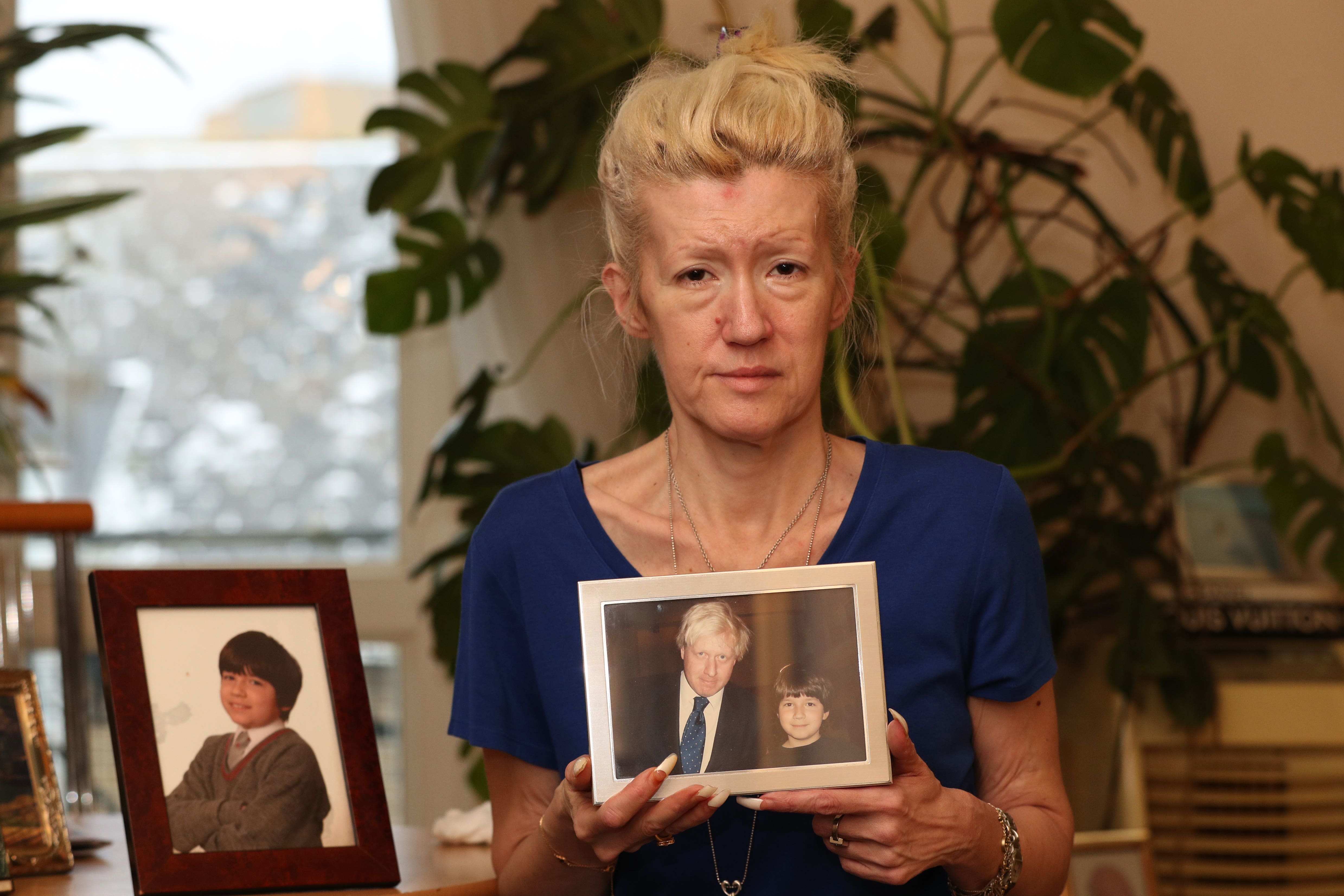 Jasna Badzak with photographs of her murdered son Sven (Jonathan Brady/PA)