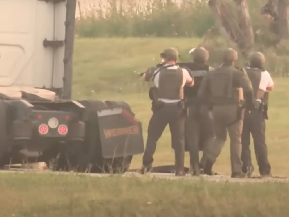 Members of the Ohio State Highway Patrol’s special response team approach a truck that had been hijacked by an elderly couple