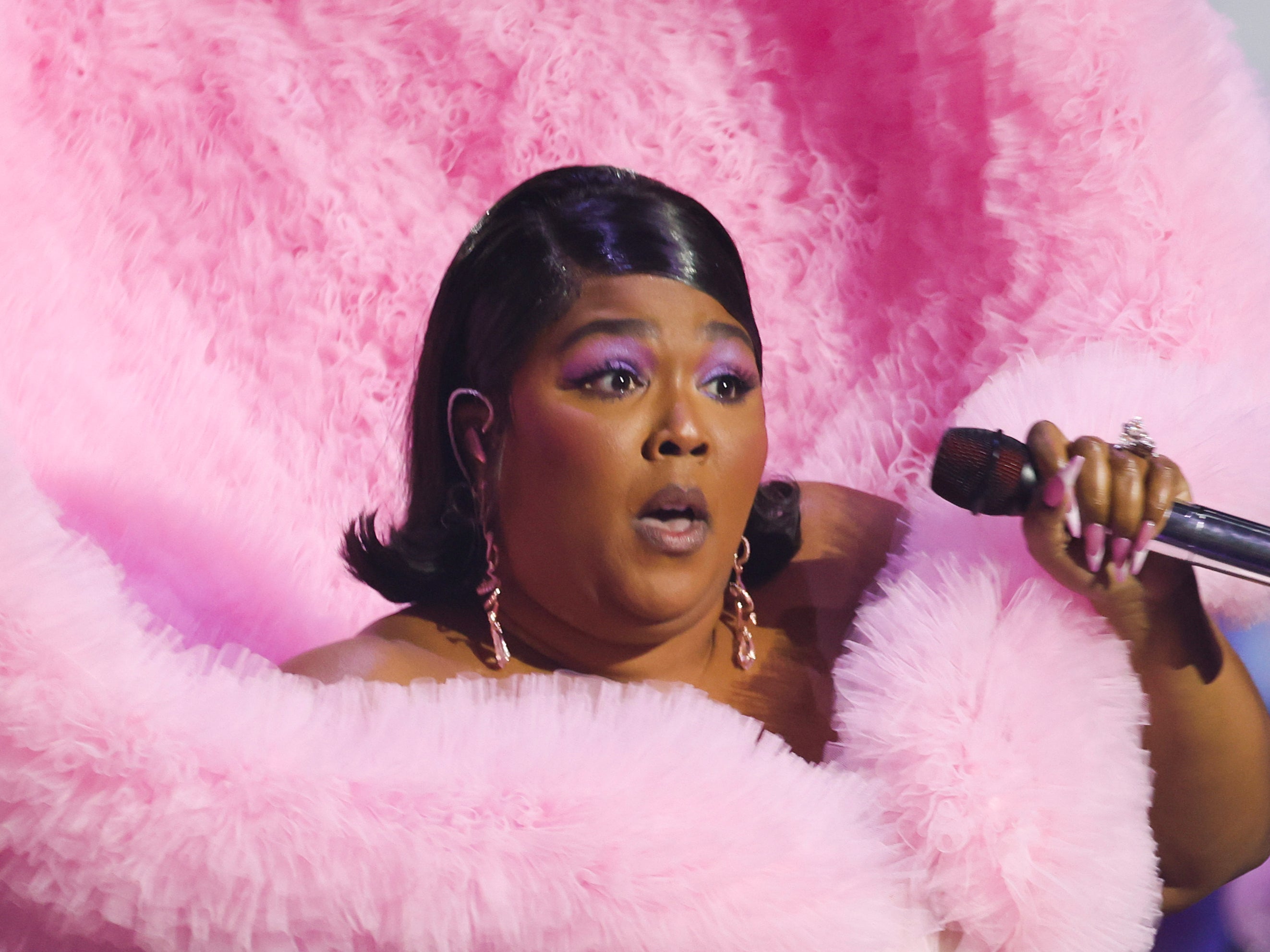 Lizzo performs onstage at the Brits