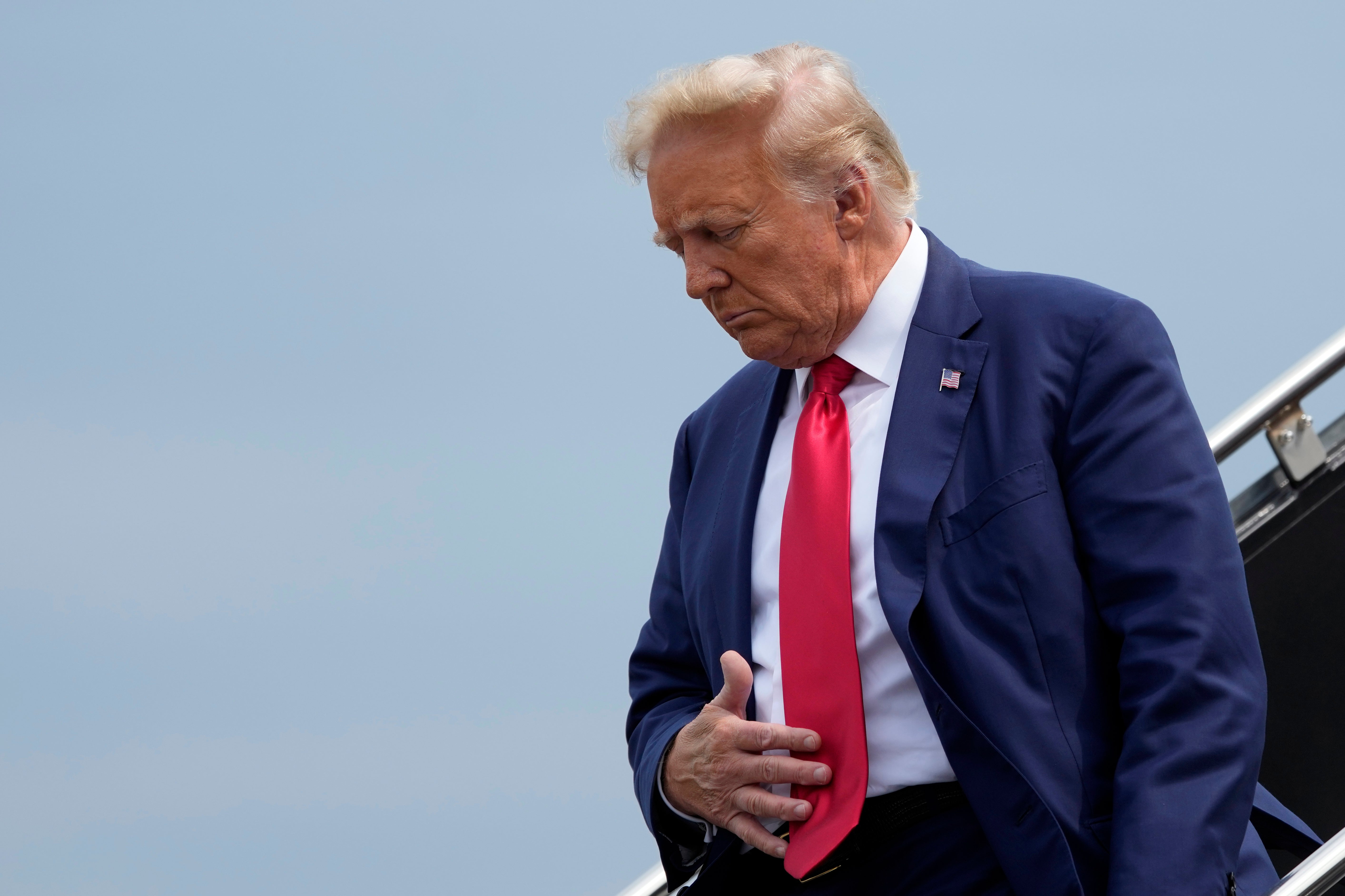 Former President Donald Trump arrives at Ronald Reagan Washington National Airport for his 3 August arraignment