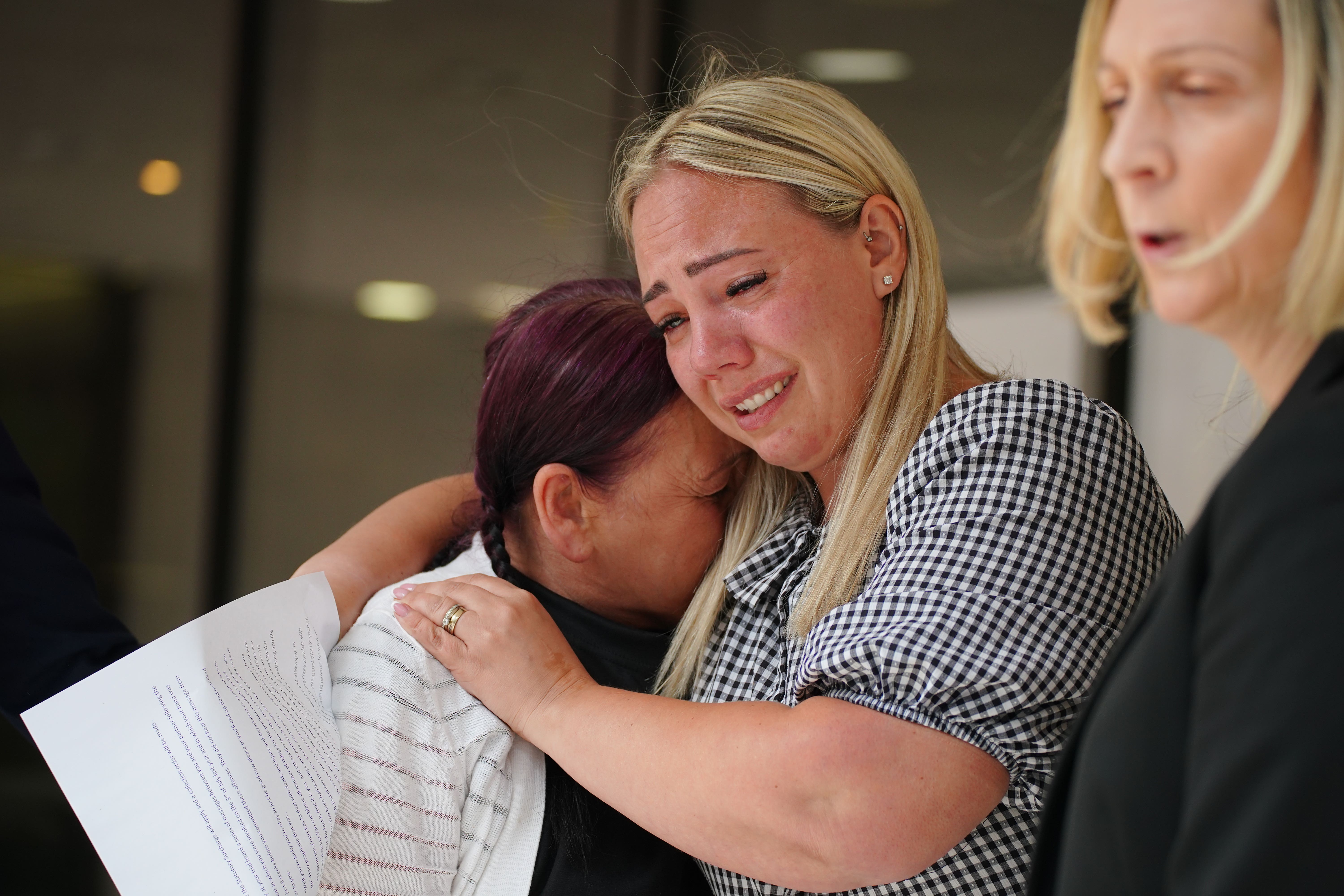 Sarah Reilly (centre), mother of Harvey Reilly, outside Manchester Crown Court, after Liam O’Pray was sentenced to life (Peter Byrne/PA)