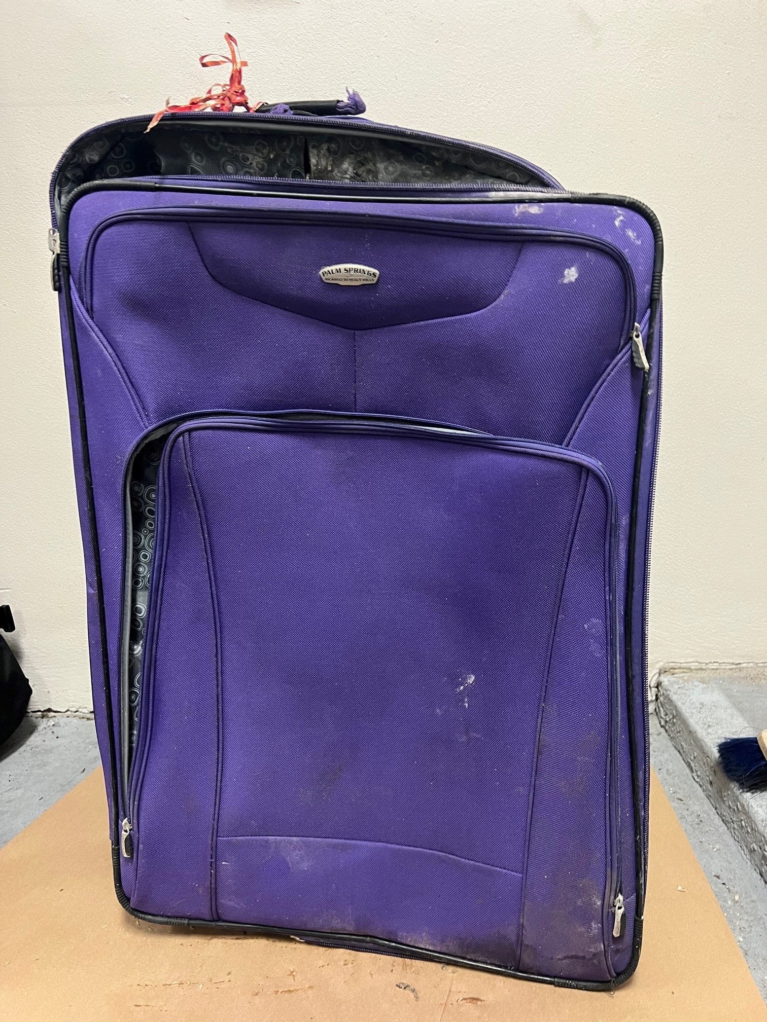 Police found the first suitcase with human remains hanging out of it when responding to a 911 call about a suspicious object in the waterway. It had been weighed down with landscaping rocks and had an airport barcode sticker for LATAM Airlines with the name "Barbosa."