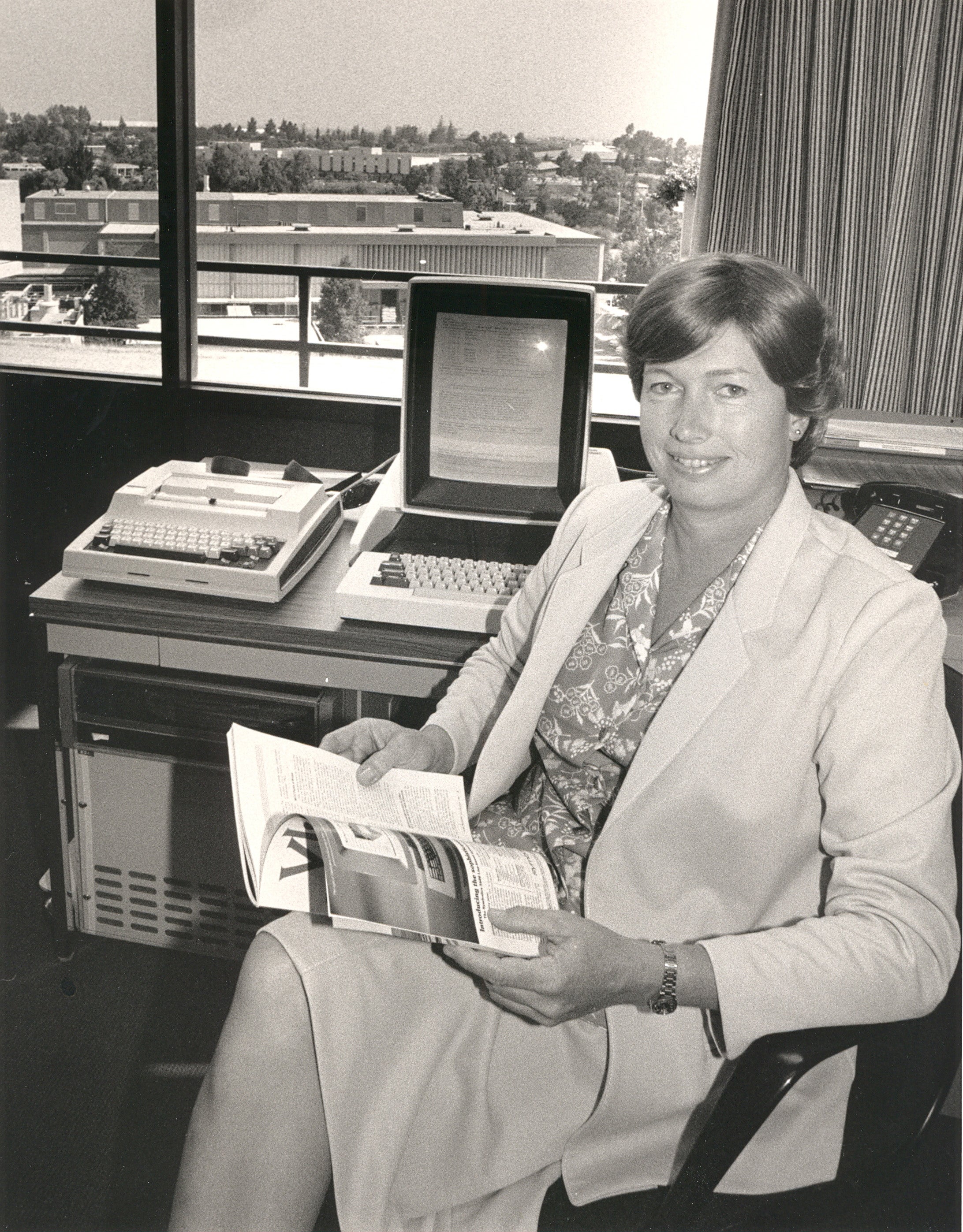 Conway sitting beside her Xerox Alto, an early personal computer developed at PARC