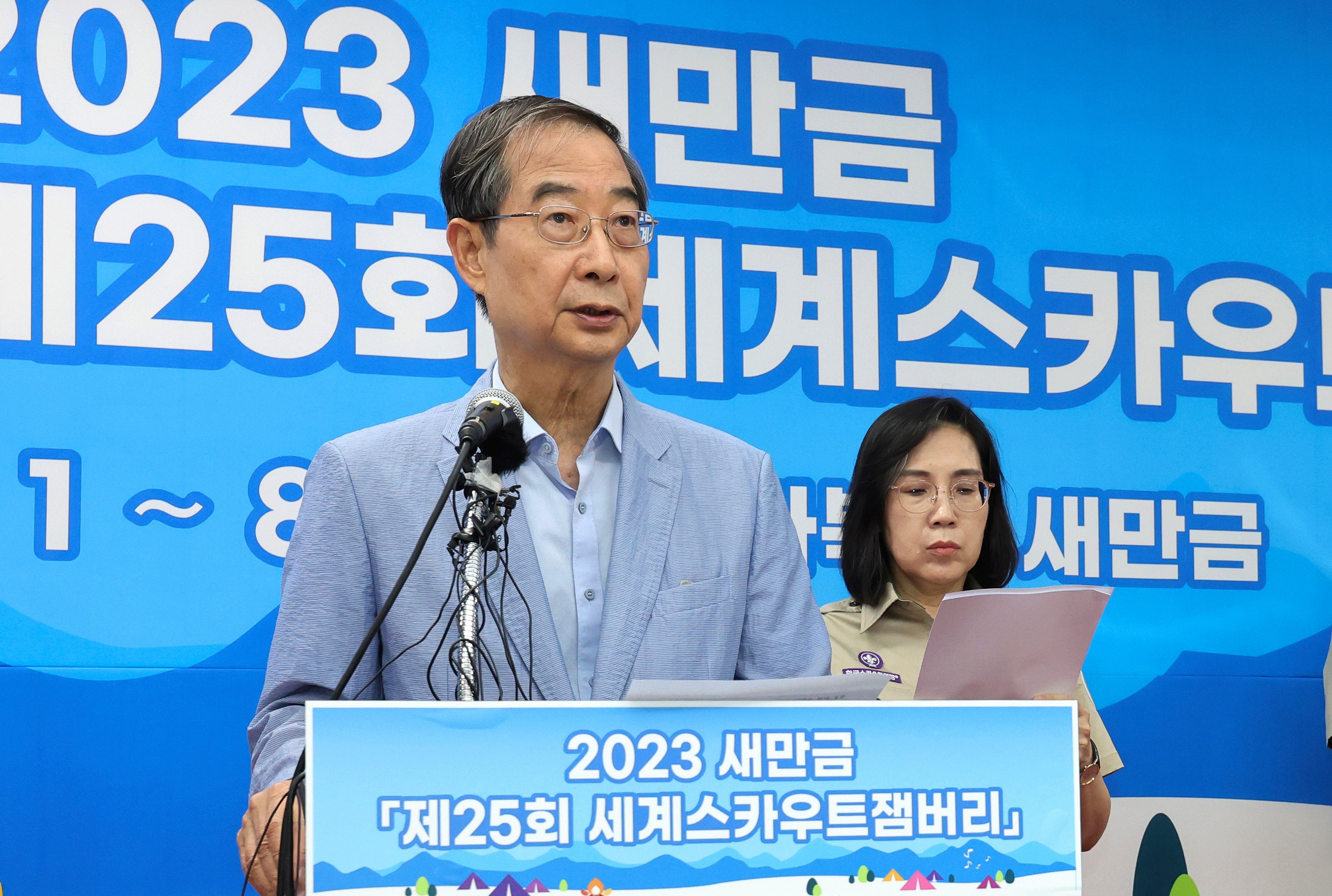 South Korean Prime Minister Han Duck-soo even became involved, here speaking during a press conference at the jamboree