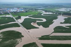 More than 30 dead in China’s torrential rain as record floods claim lives of municipal officials