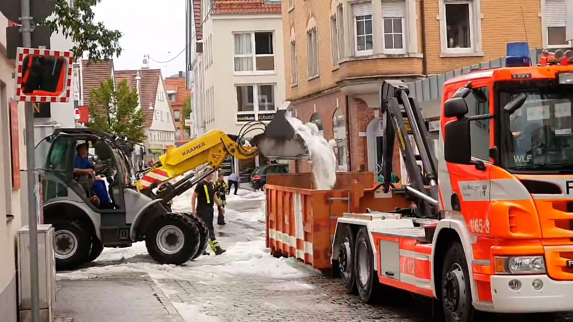 A snowplow picks up hail on the streets in Reutlingen, southern Germany, on August 4, 2023.