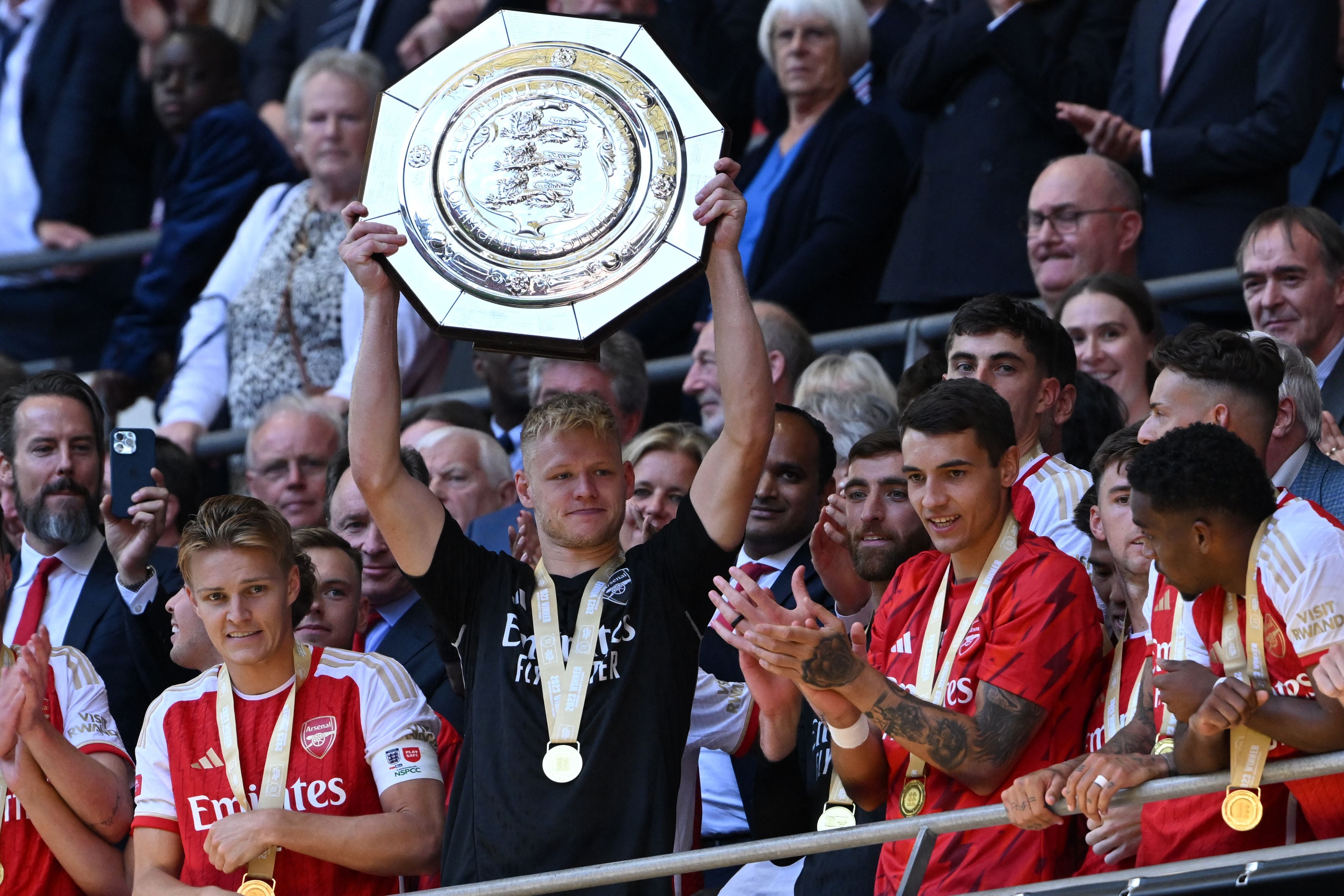 Aaron Ramsdale lifts the trophy on Sunday evening