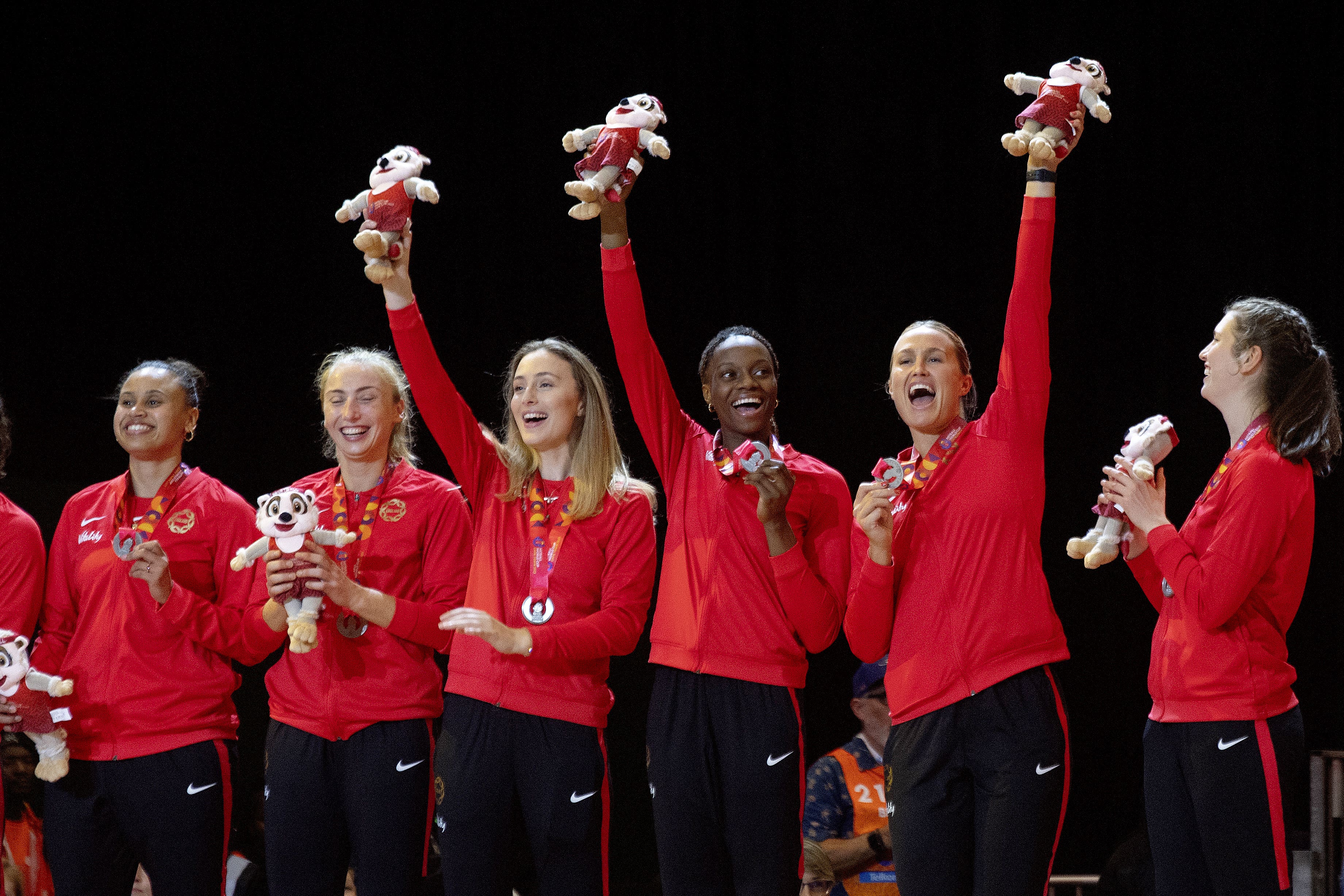 England players with silver medals after the 2023 Netball World Cup final at the Cape Town International Convention Centre (PA)