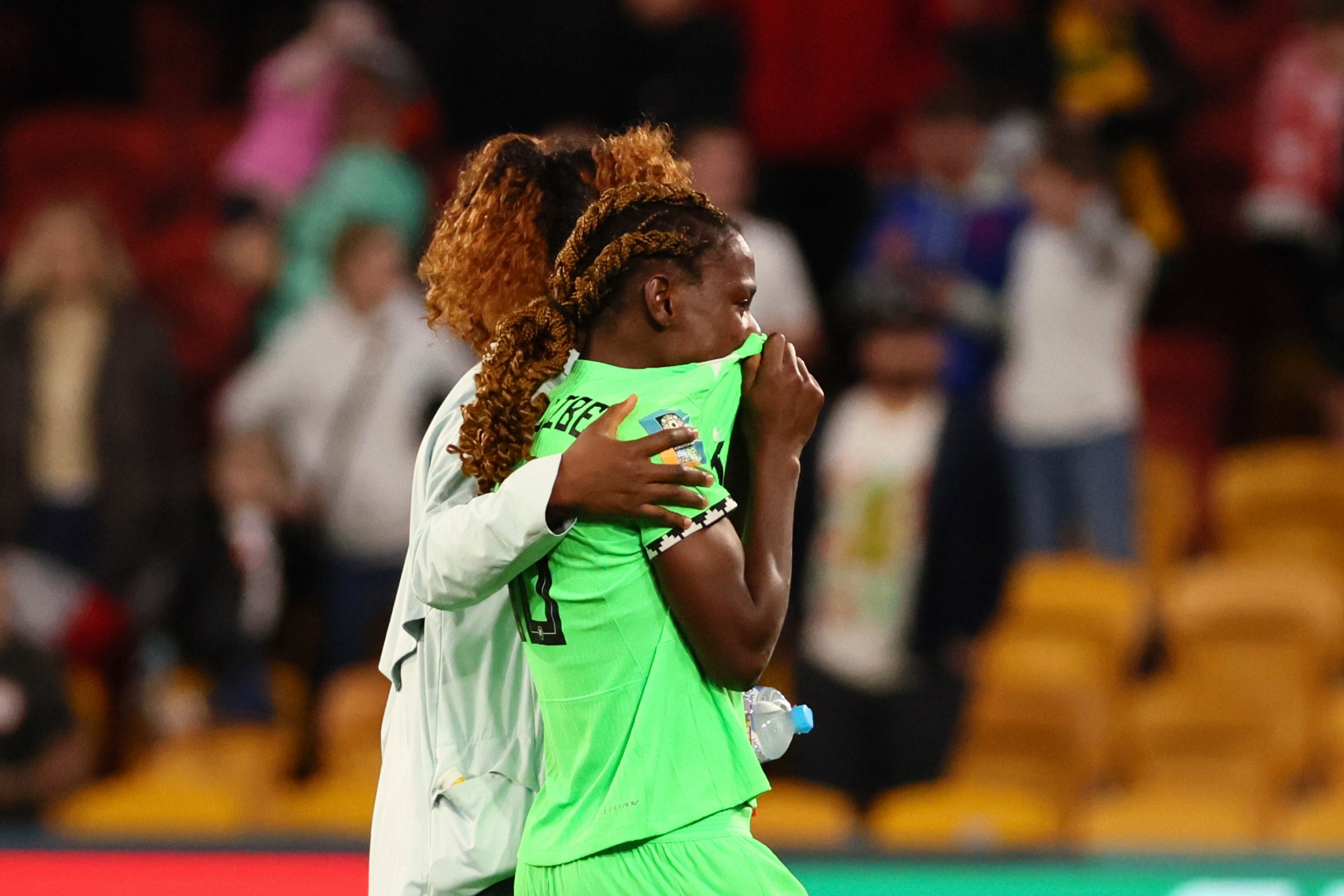 Christy Ucheibe leaves the pitch after Nigeria fail to beat England