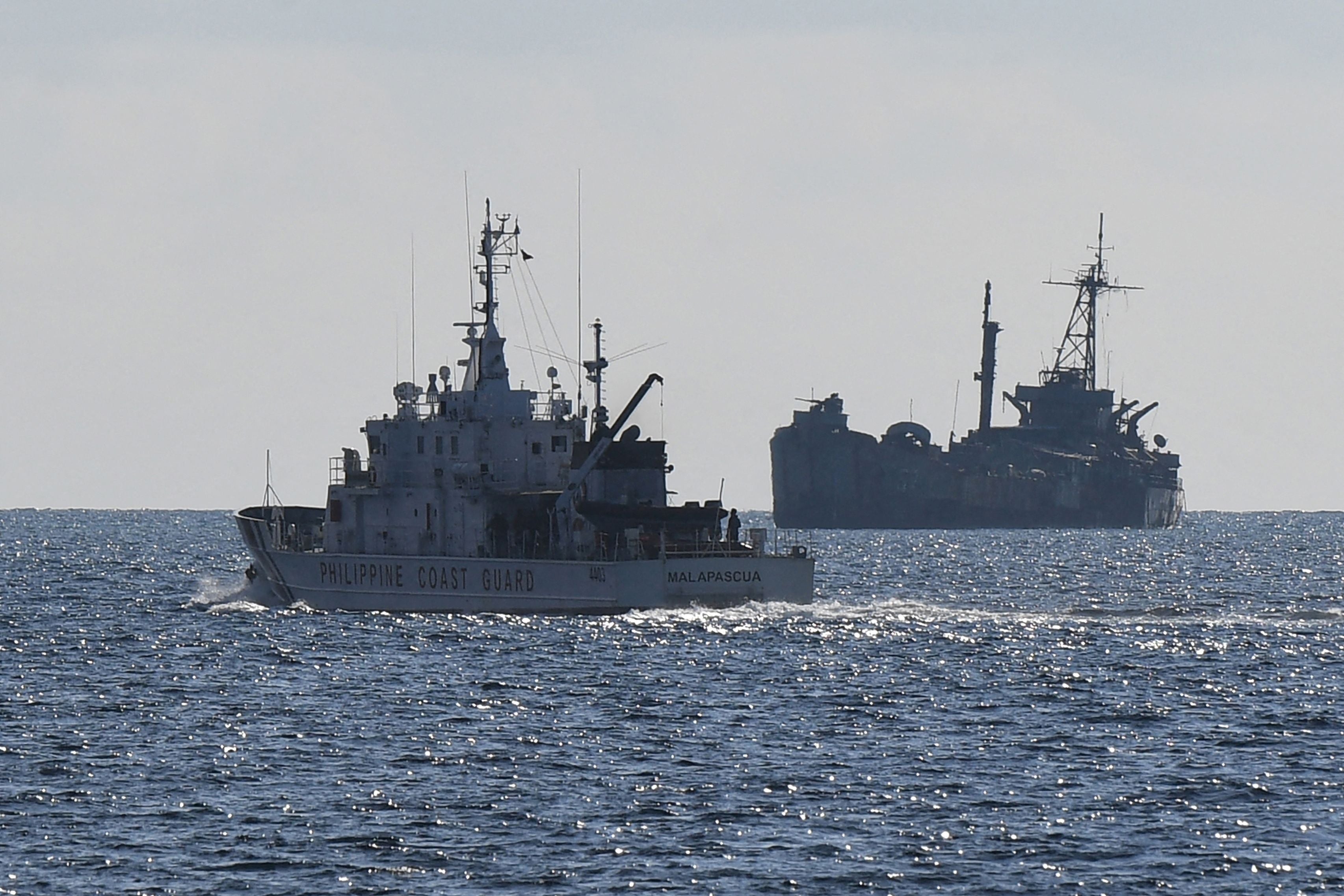 Philippine coast guard vessel ‘BRP Malapascua’ patrols the grounded navy ship BRP ‘Sierra Madre’