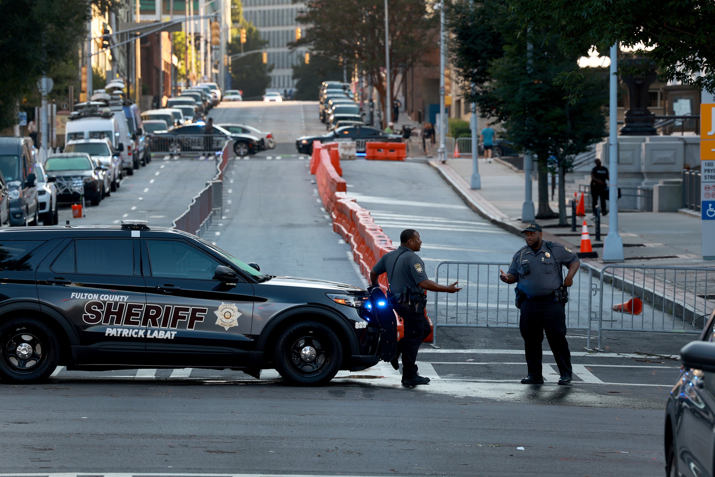 Fulton County Sheriff officers block off a street in front of the Fulton County Courthouse on August 07, 2023 in Atlanta, Georgia
