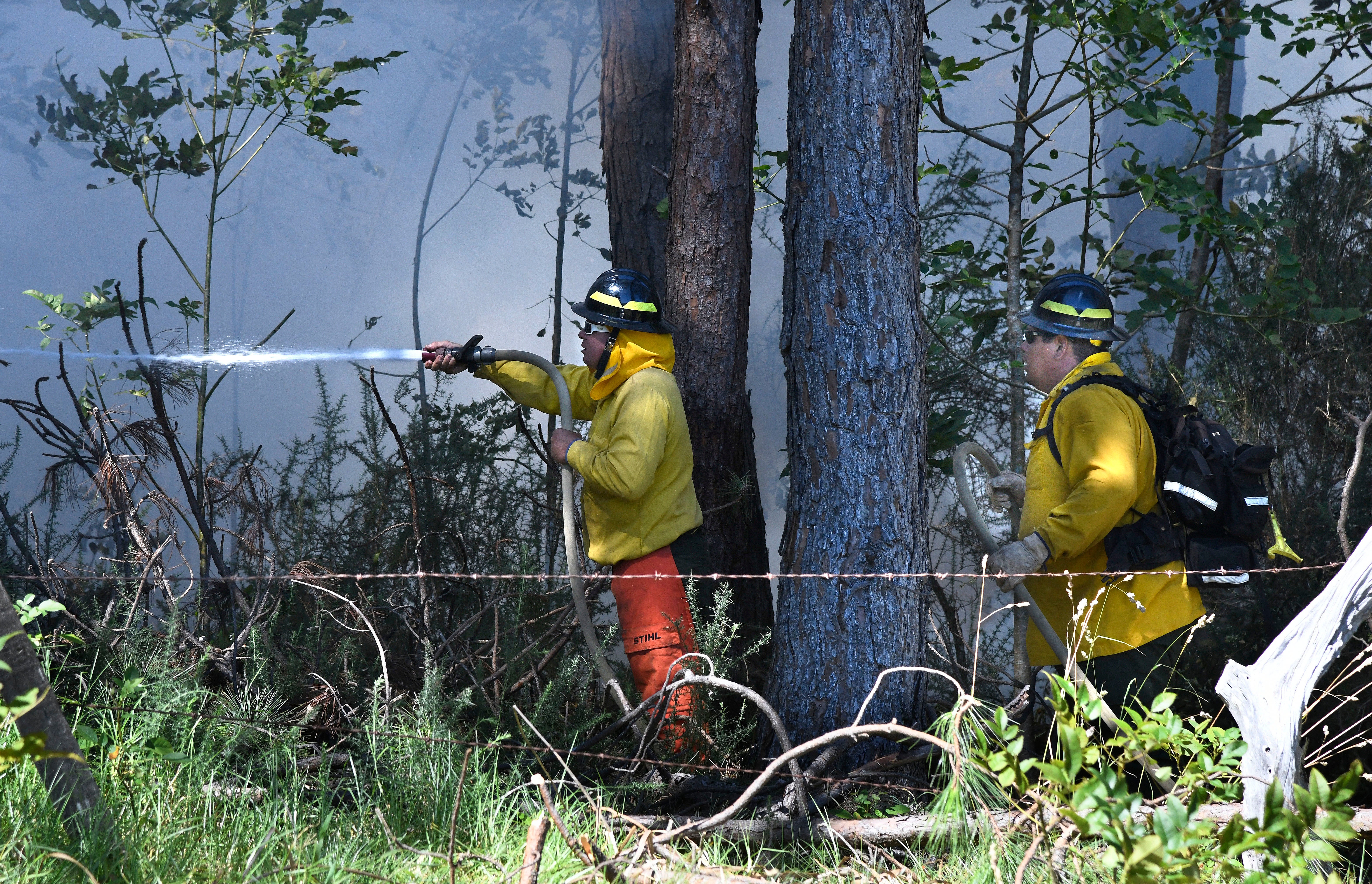 Efforts to control several wildfires on Maui have been hampered by erratic winds from Hurricane Dora