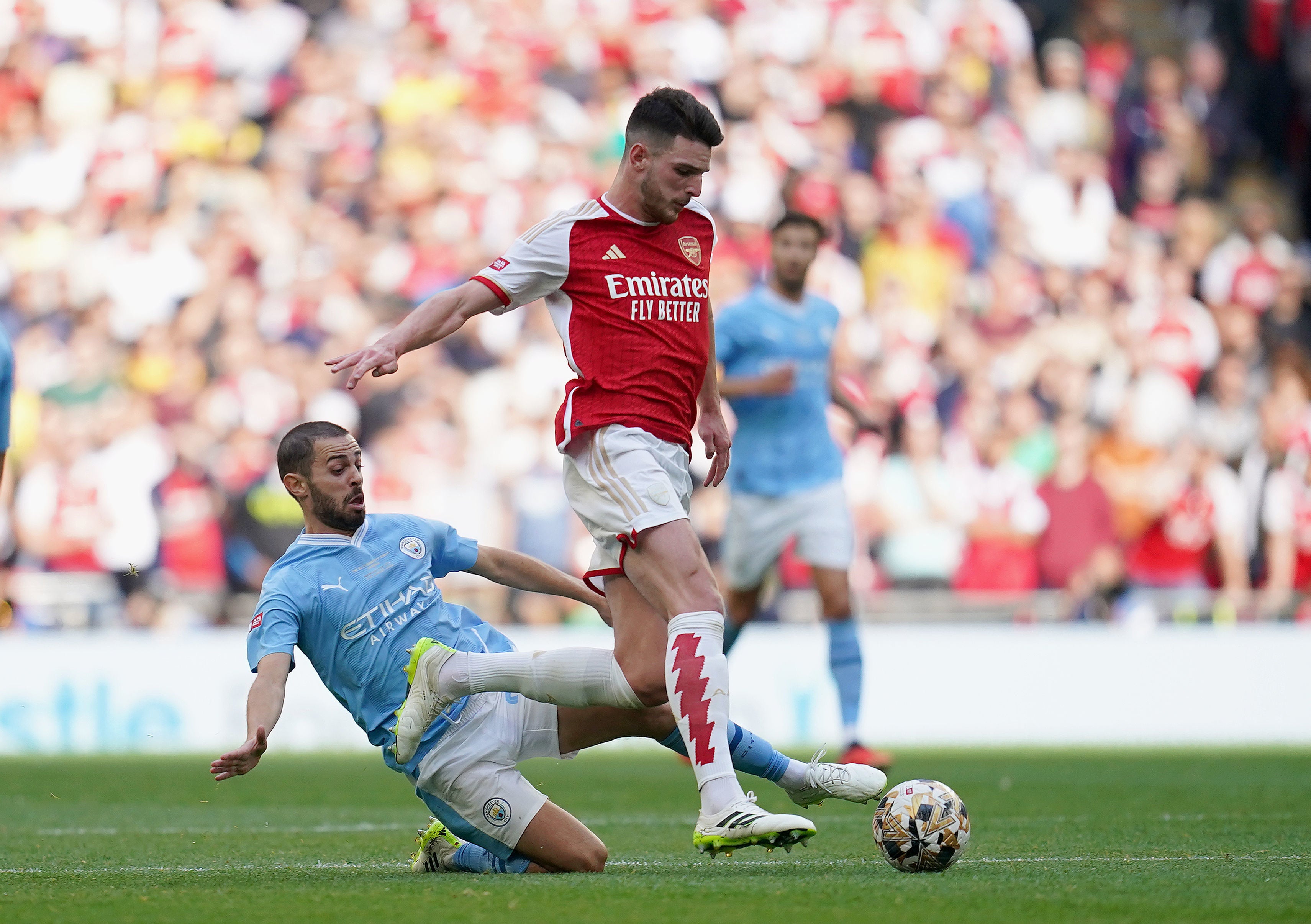 Arsenal's Rice competes with Manchester City's Bernardo Silva in the Community Shield