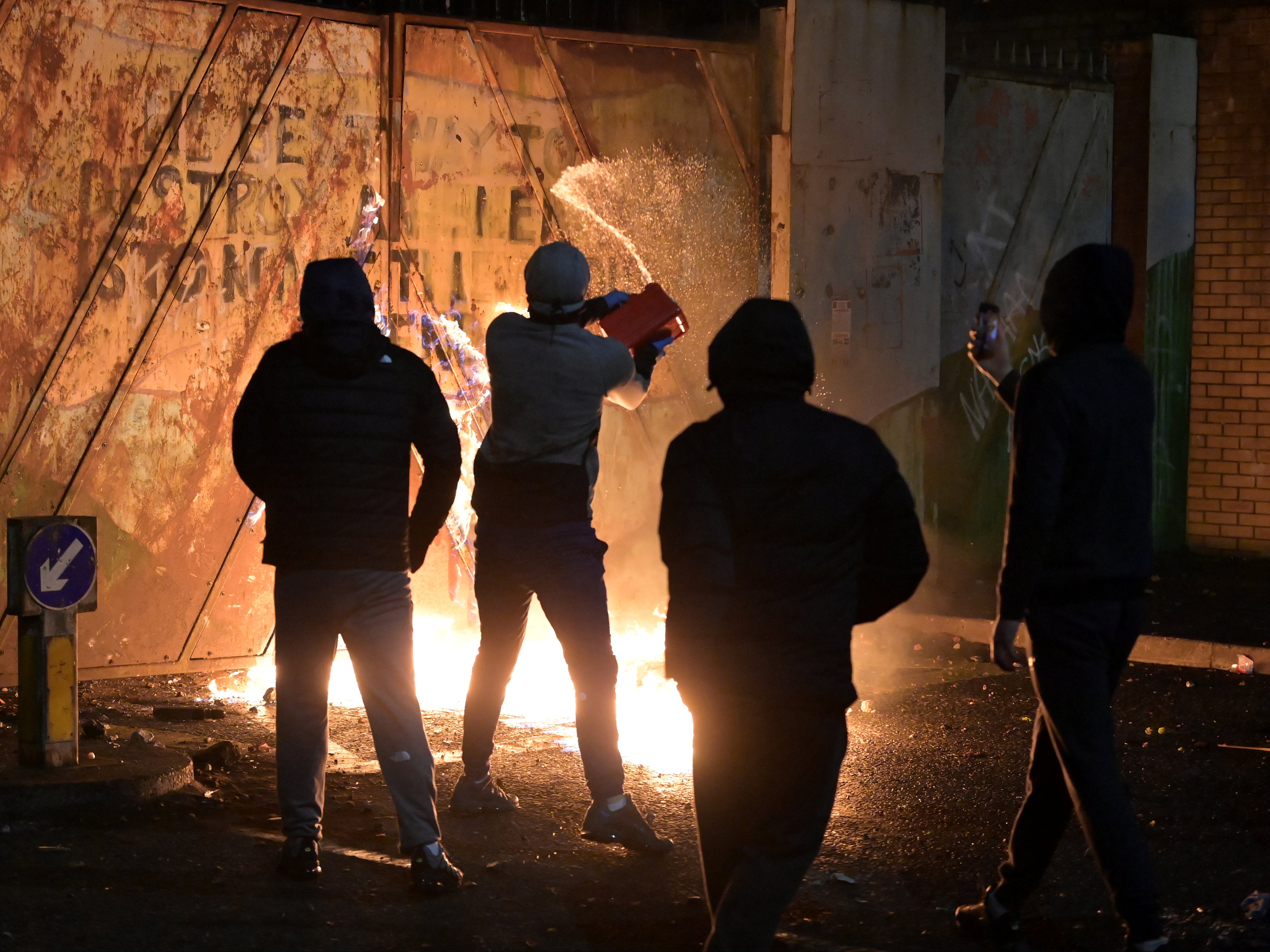 Petrol was poured as youths exchanged projectiles at Belfast’s Peace Gate with their faces covered during clashes in April 2021