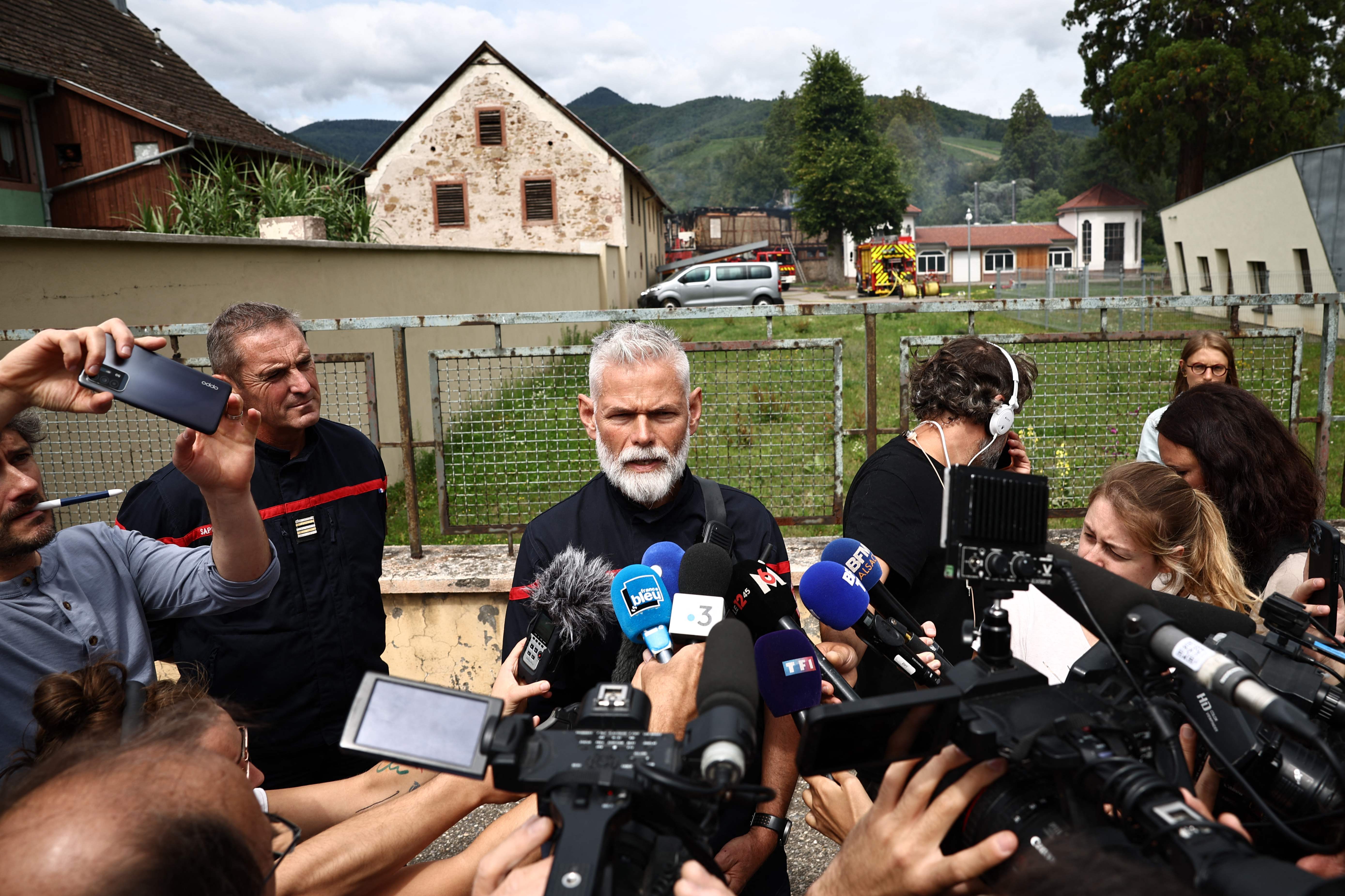 Philippe Hauwiller, who is leading the fire brigade search operation, speaks to the media