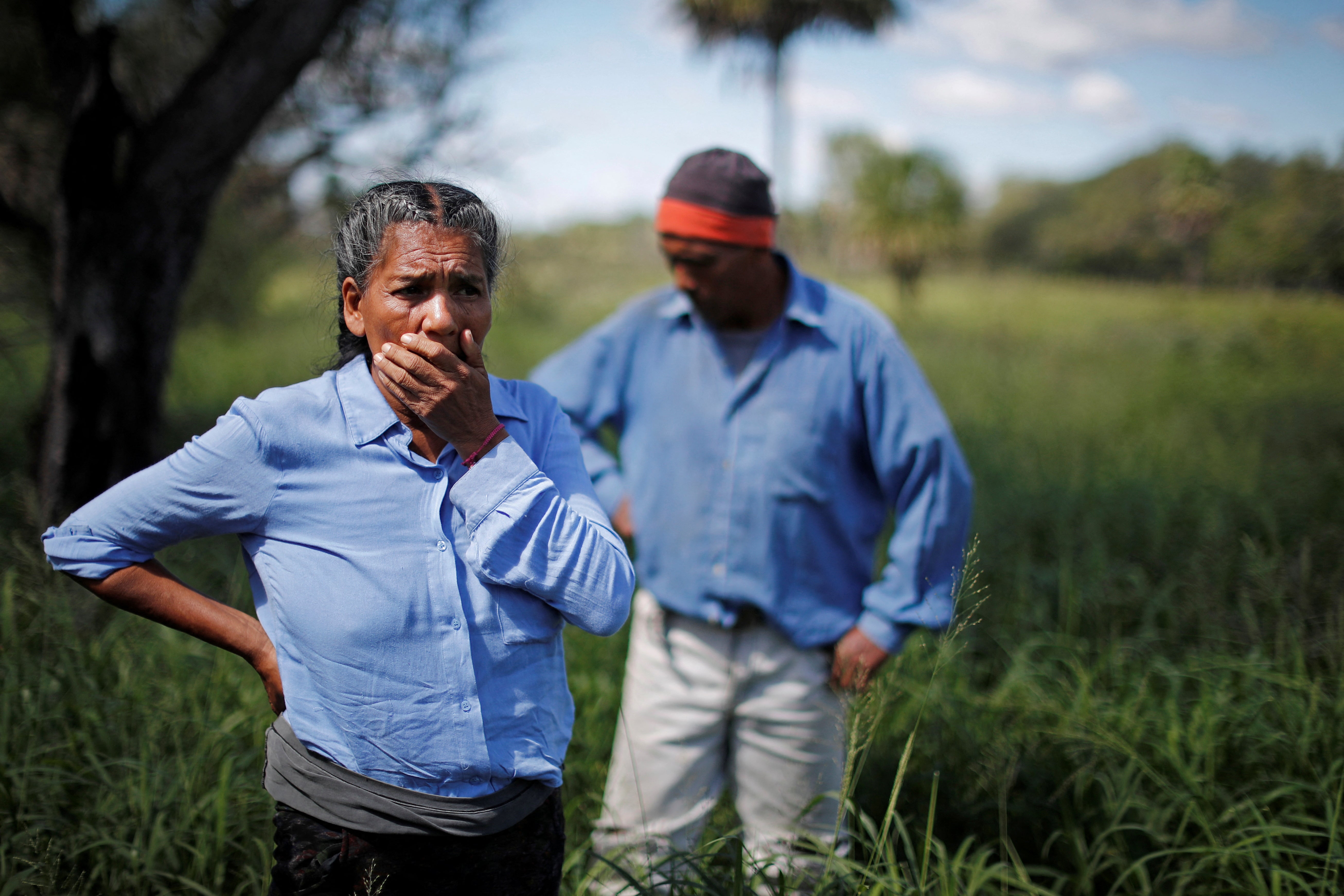 Jose Rolando Fernandez stands with Noole near his farm, where there has been a deforestation time ago and now it’s used for cattle, in Pozo del Tigre in Formosa, Argentina