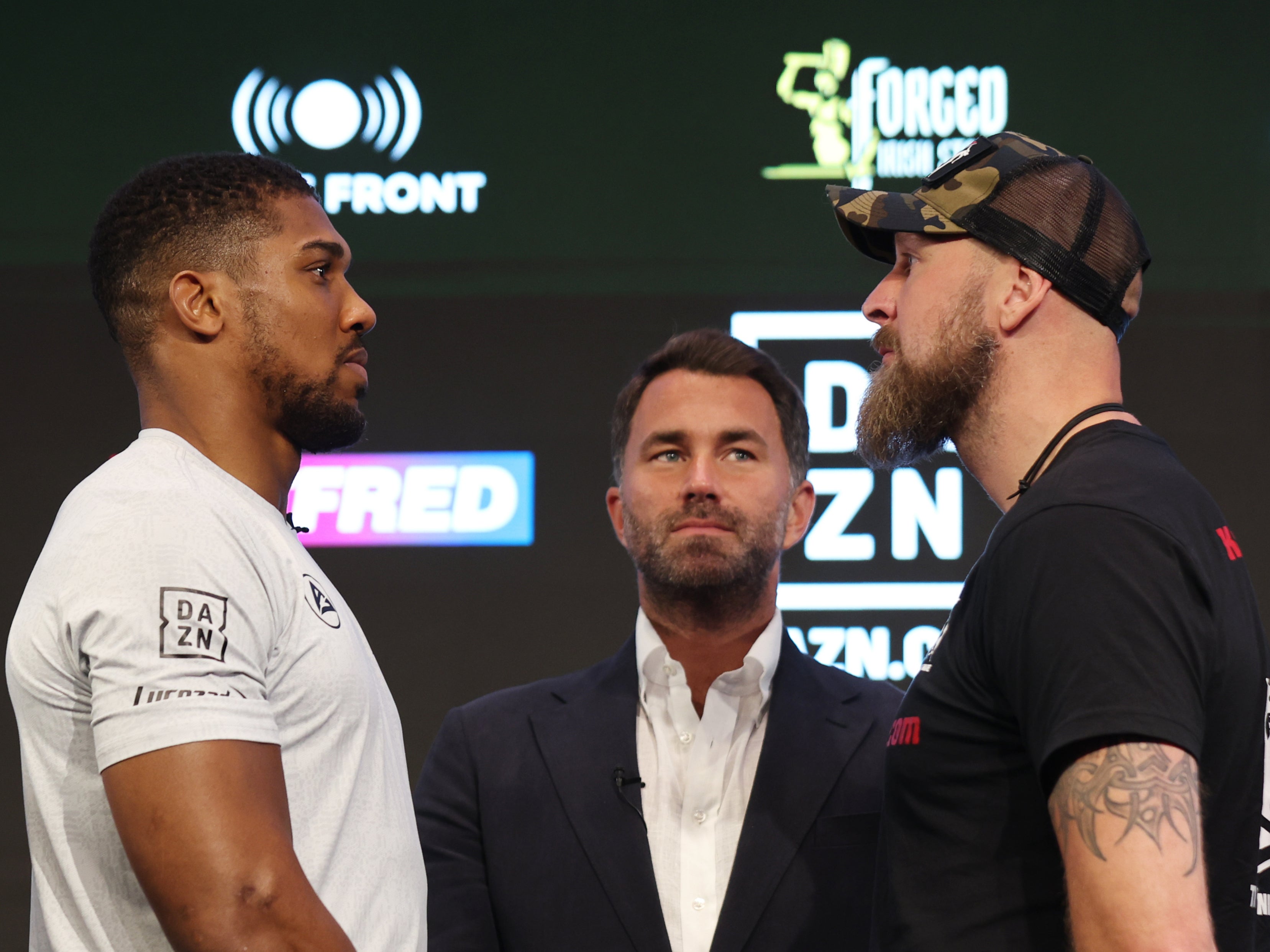 Anthony Joshua, left, and Robert Helenius face off at their pre-fight press conference