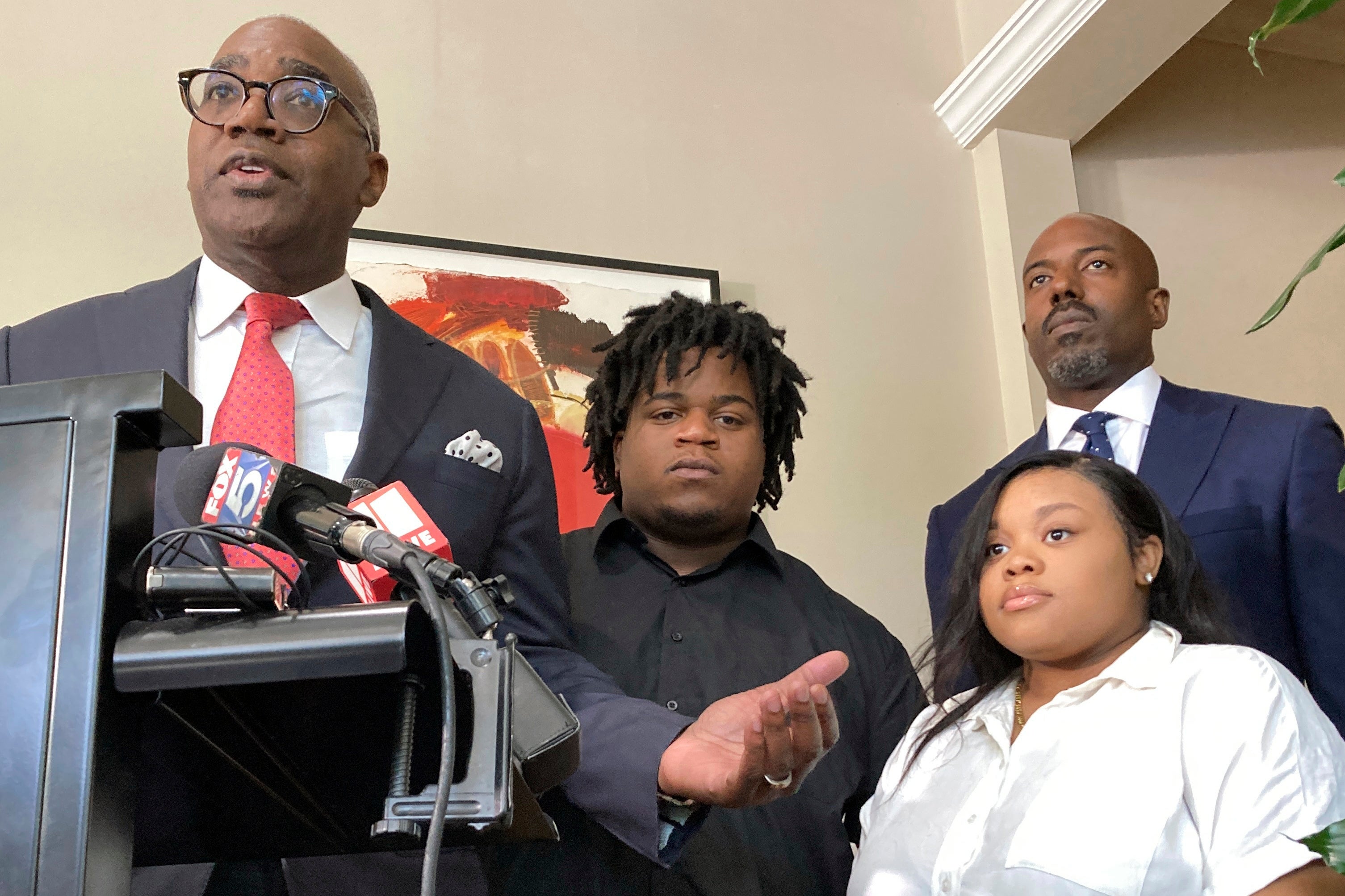 The baby’s mother and father Jessica Ross and Treveon Isaiah Taylor Sr (centre), with attorneys Roderick Edmond (left) and Cory Lynch (right)