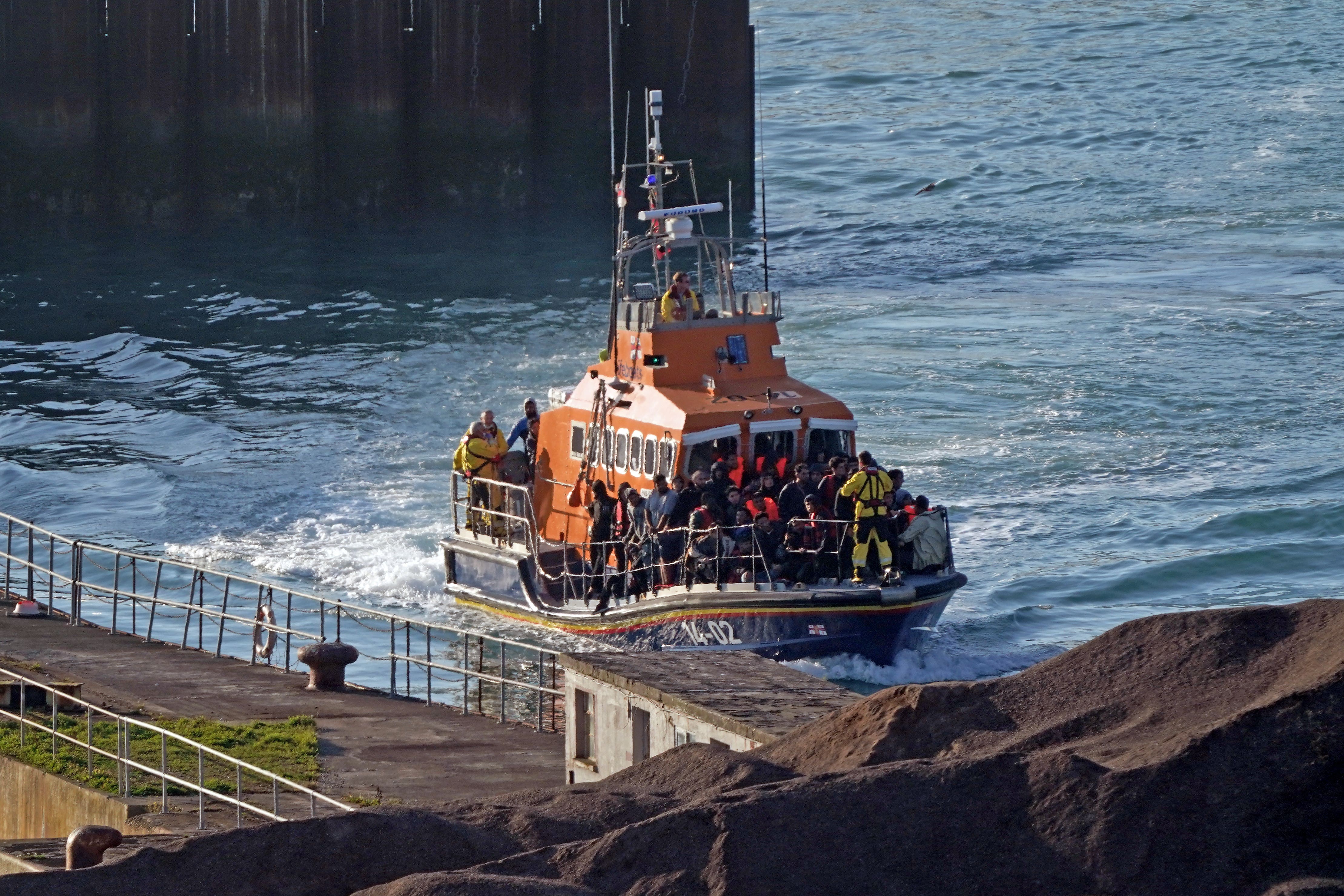 A group of people thought to be migrants are brought into Dover, Kent, onboard the Ramsgate Lifeboat following a small boat incident in the Channel (Gareth Fuller/PA)