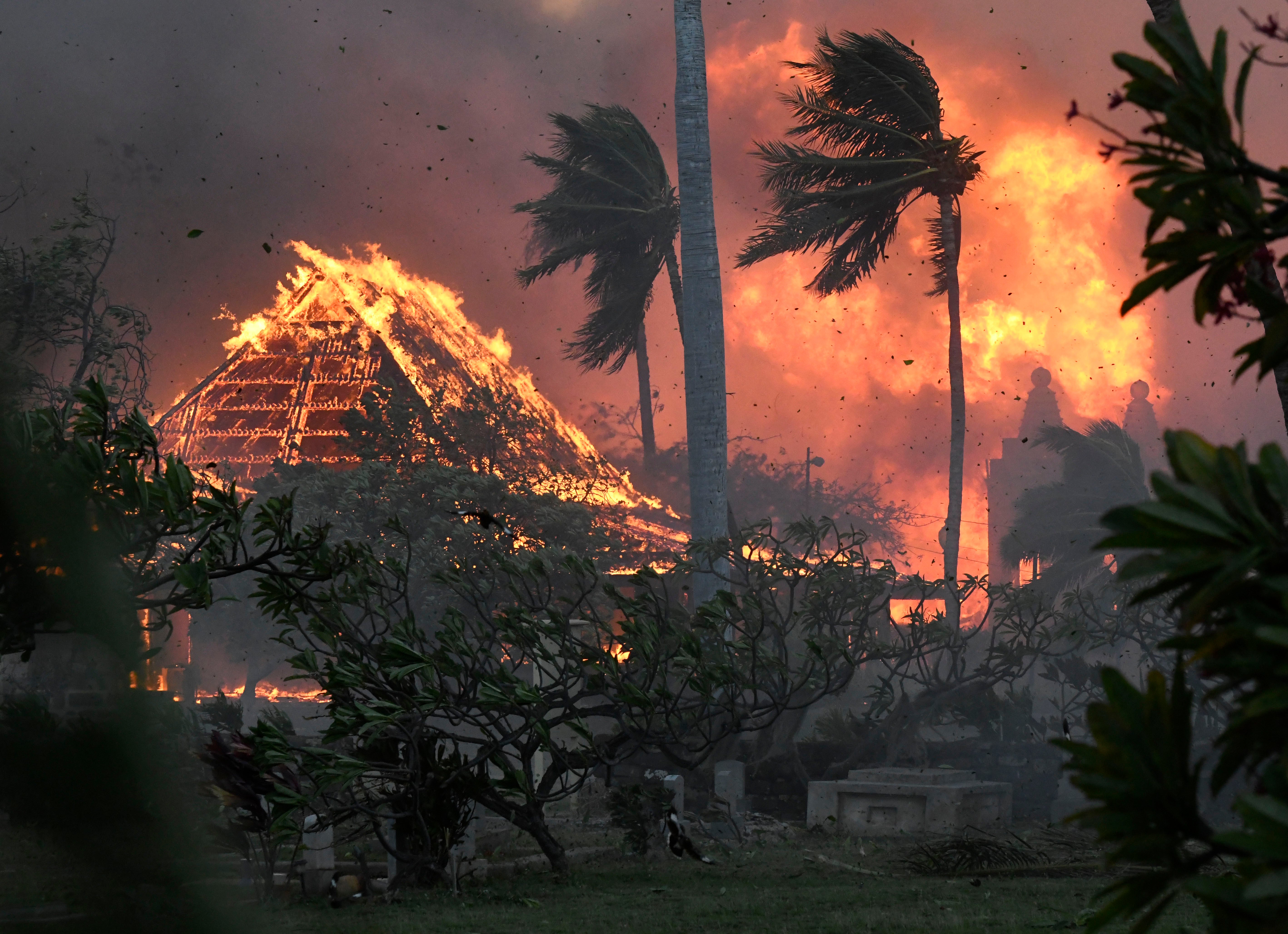 The hall of historic Waiola Church in Lahaina and nearby Lahaina Hongwanji Mission are engulfed in flames along Wainee Street