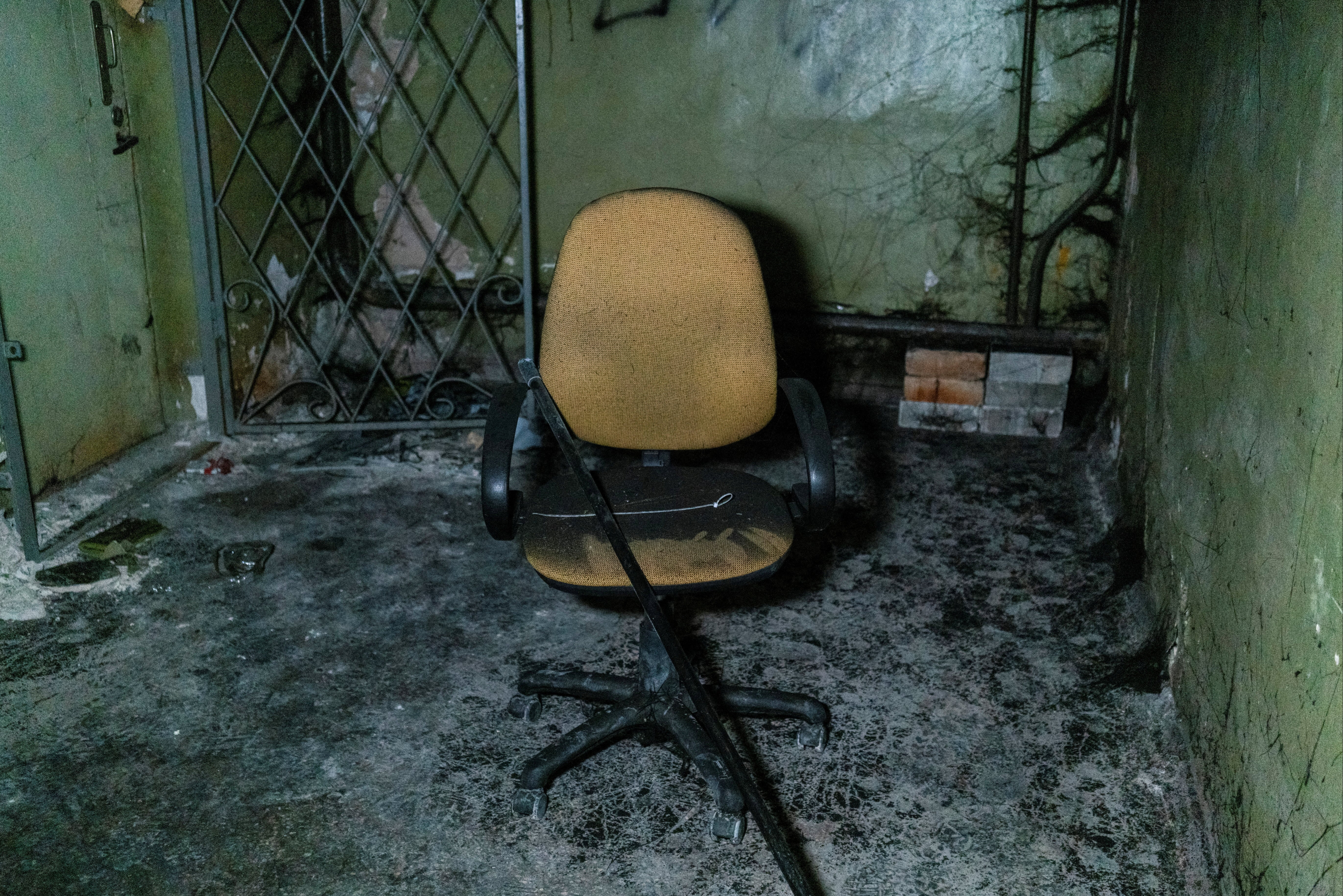 Plastic ties for torture and a broken chair were pictured inside a basement in Kherson