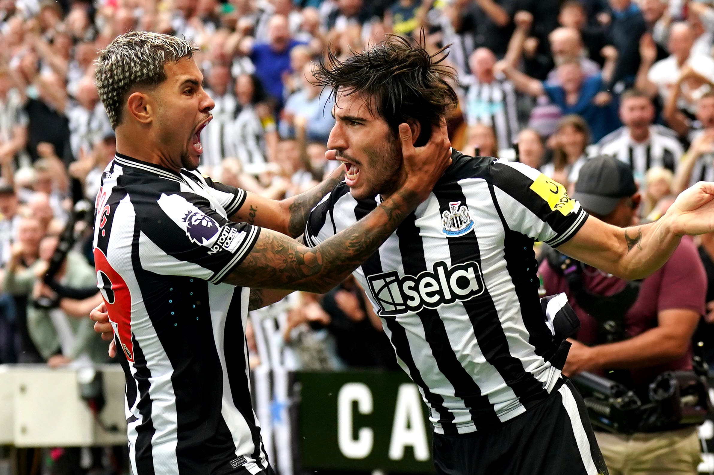 Sandro Tonali, right, opened the scoring on his Newcastle debut in the sparkling performance (Owen Humphreys/PA)