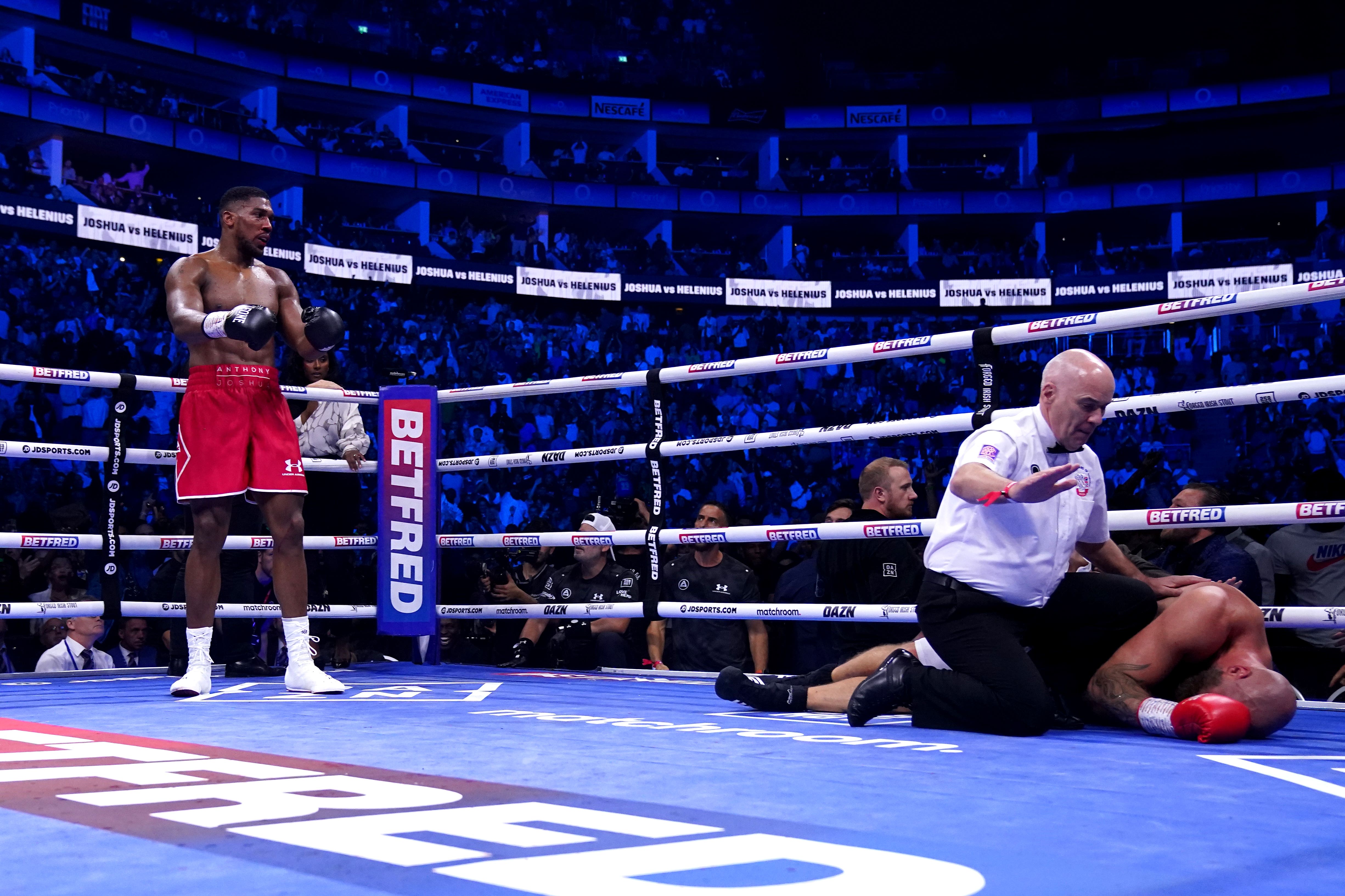 Anthony Joshua (left) knocks out Robert Helenius at London’s O2 Arena (Nick Potts/PA)