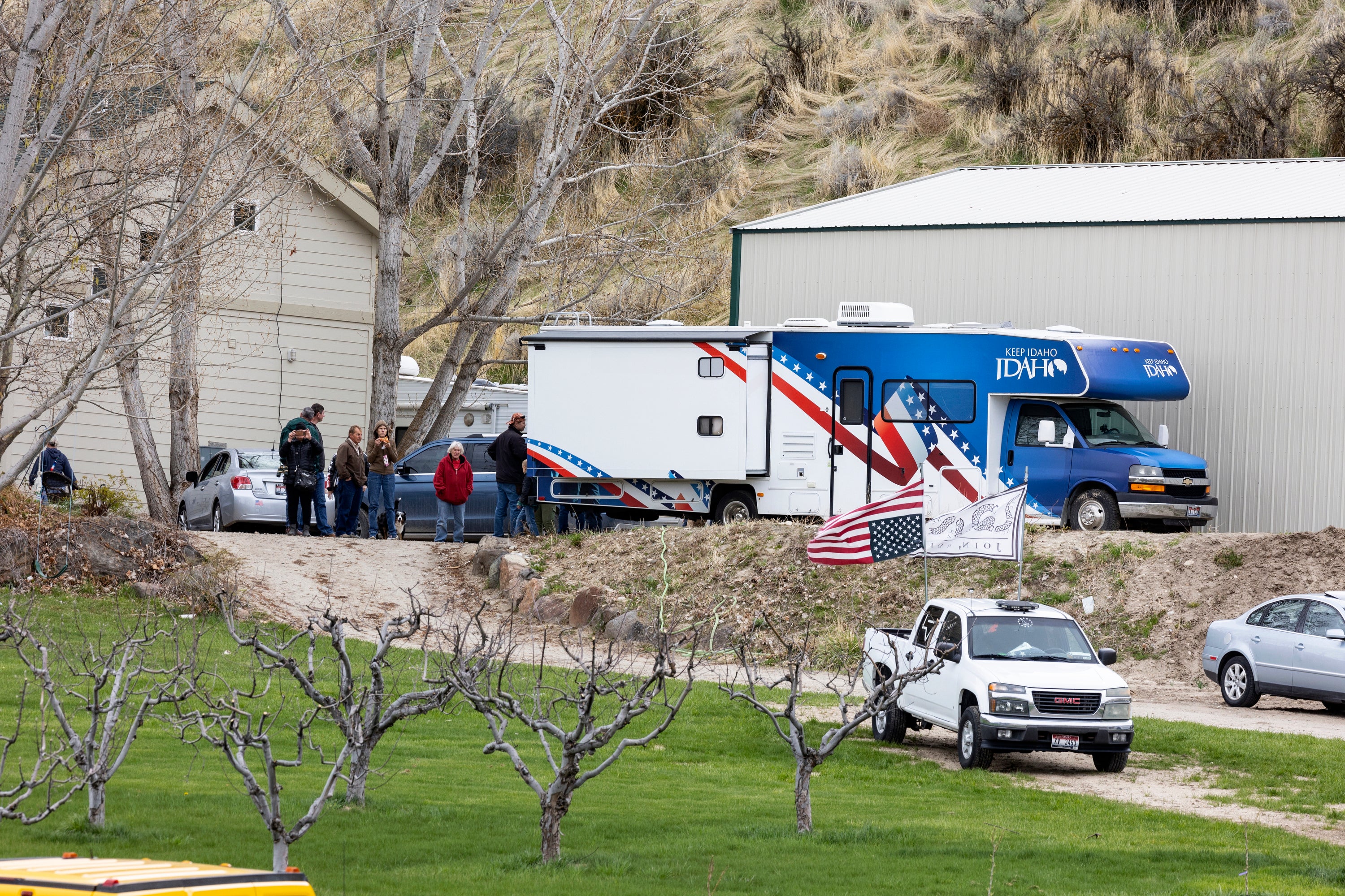 Ammon Bundy’s supporters are pictured gathering at his property in April 2023 as law enforcement sought to arrest him on a contempt of court charge connected to a defamation lawsuit that Bundy has refused to acknowledge.