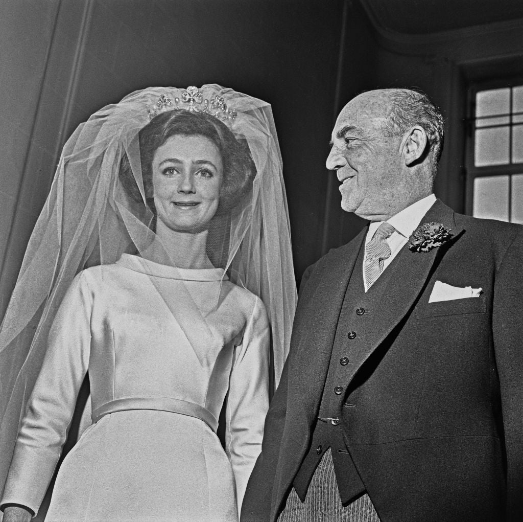 Lindy photographed on her wedding day with her father, politician and businessman Loel Guinness