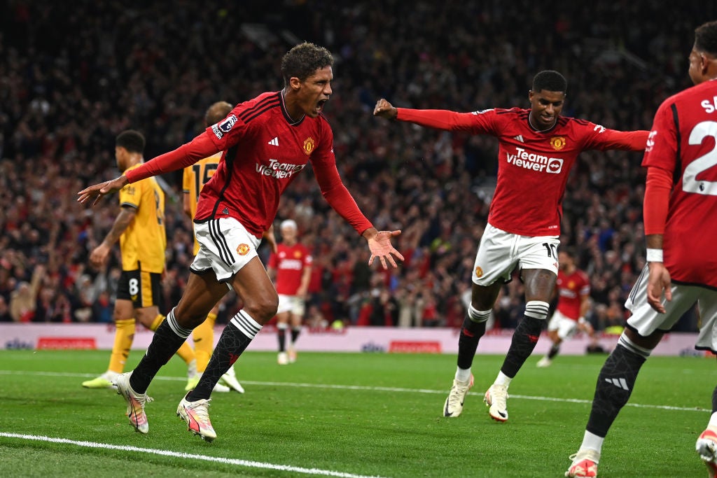 Raphael Varane celebrates scoring United’s opener for the season