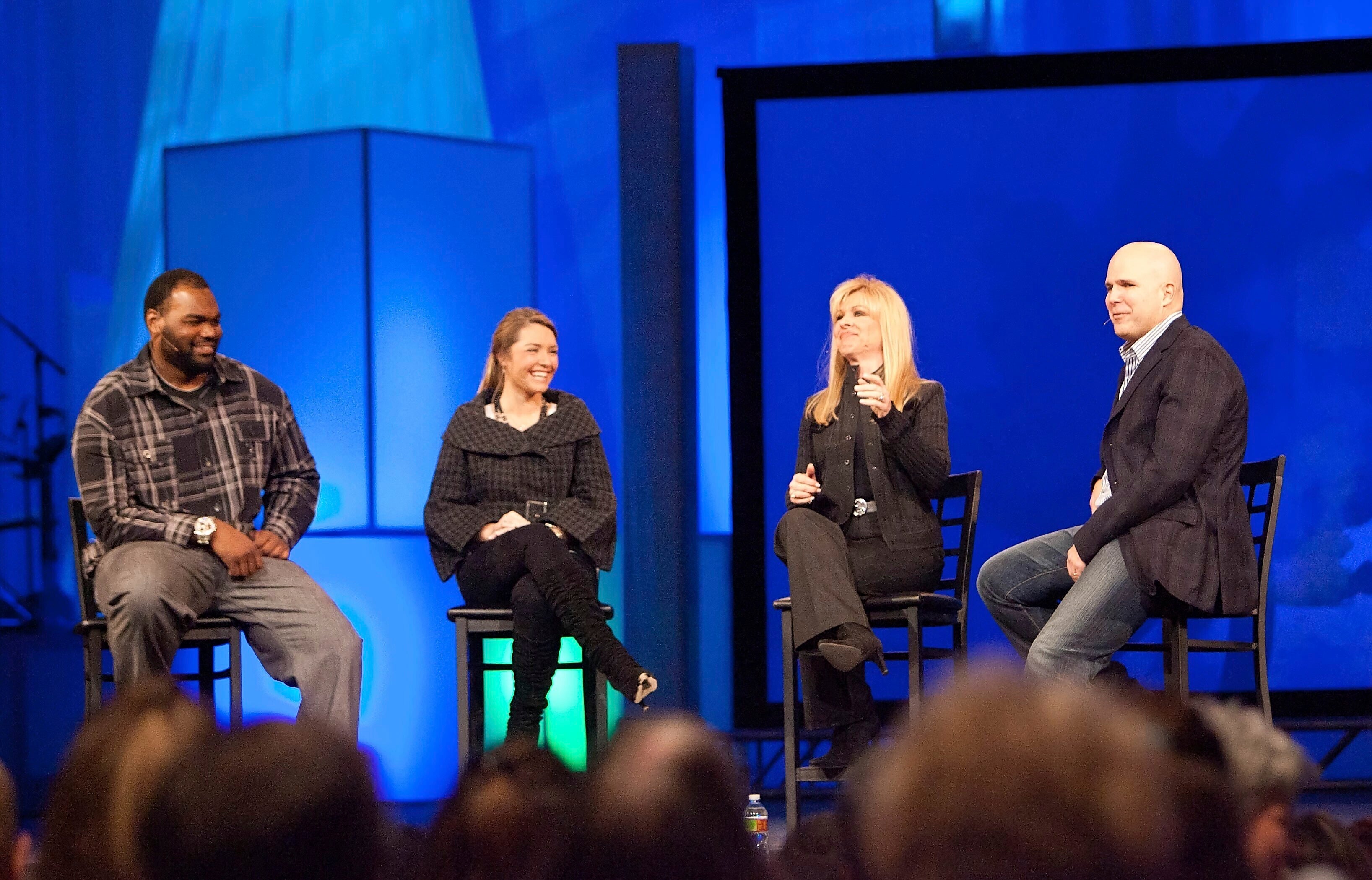 FILE - Michael Oher, left, Collins Tuohy, second from left, and Leigh Anne Tuohy, whose lives are portrayed in the Oscar-nominated movie "The Blind Side," speak with Pastor Kerry Shook, right, March 3, 2010 at Woodlands Church's Fellowship Campus in The Woodlands, TX.