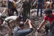 India landslides: Rescuers dig through mud in desperate search for survivors