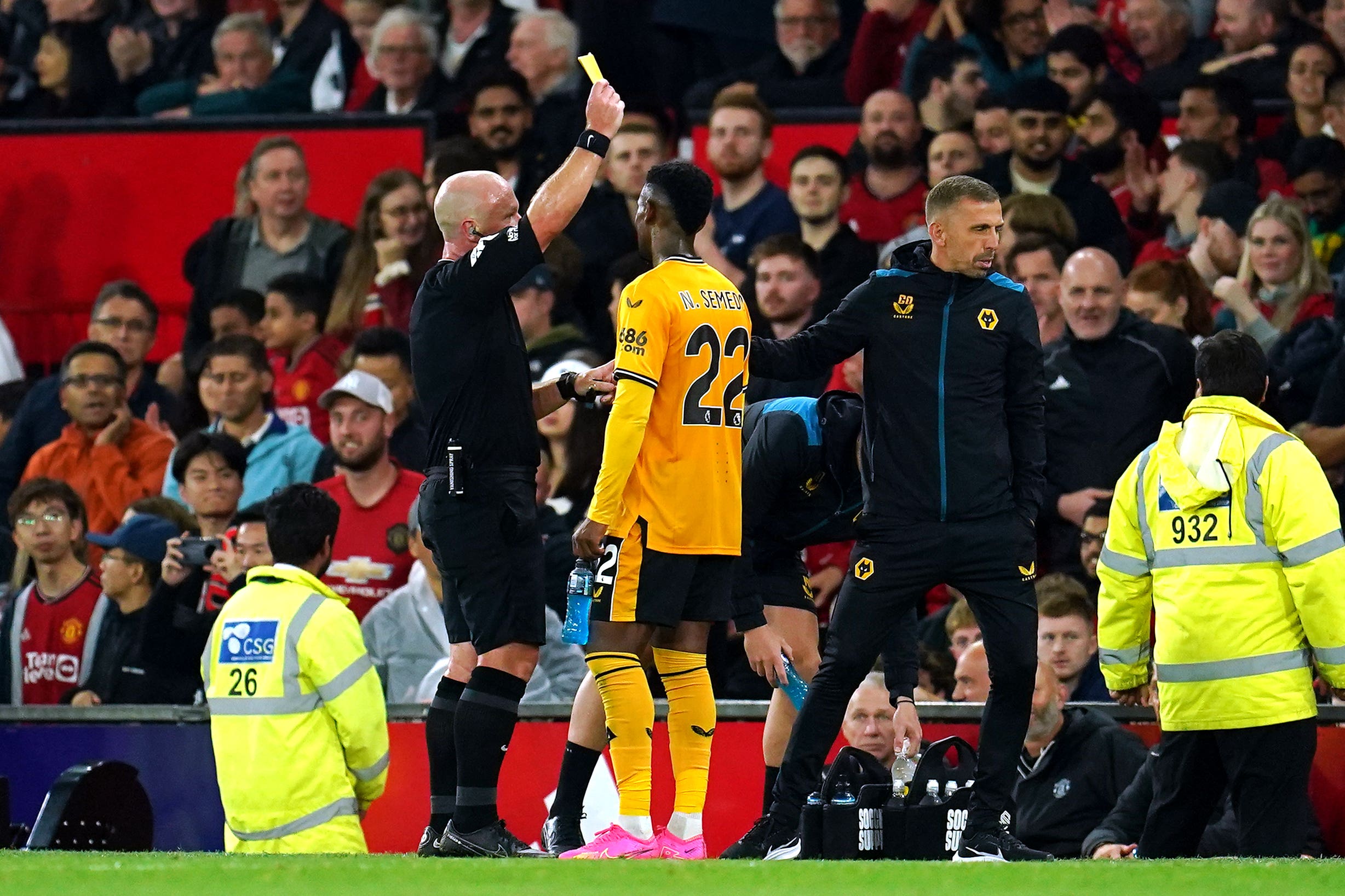 Referee Simon Hooper (left) did not award Wolves what looked a penalty during stoppage-time at Old Trafford (Nick Potts/PA)