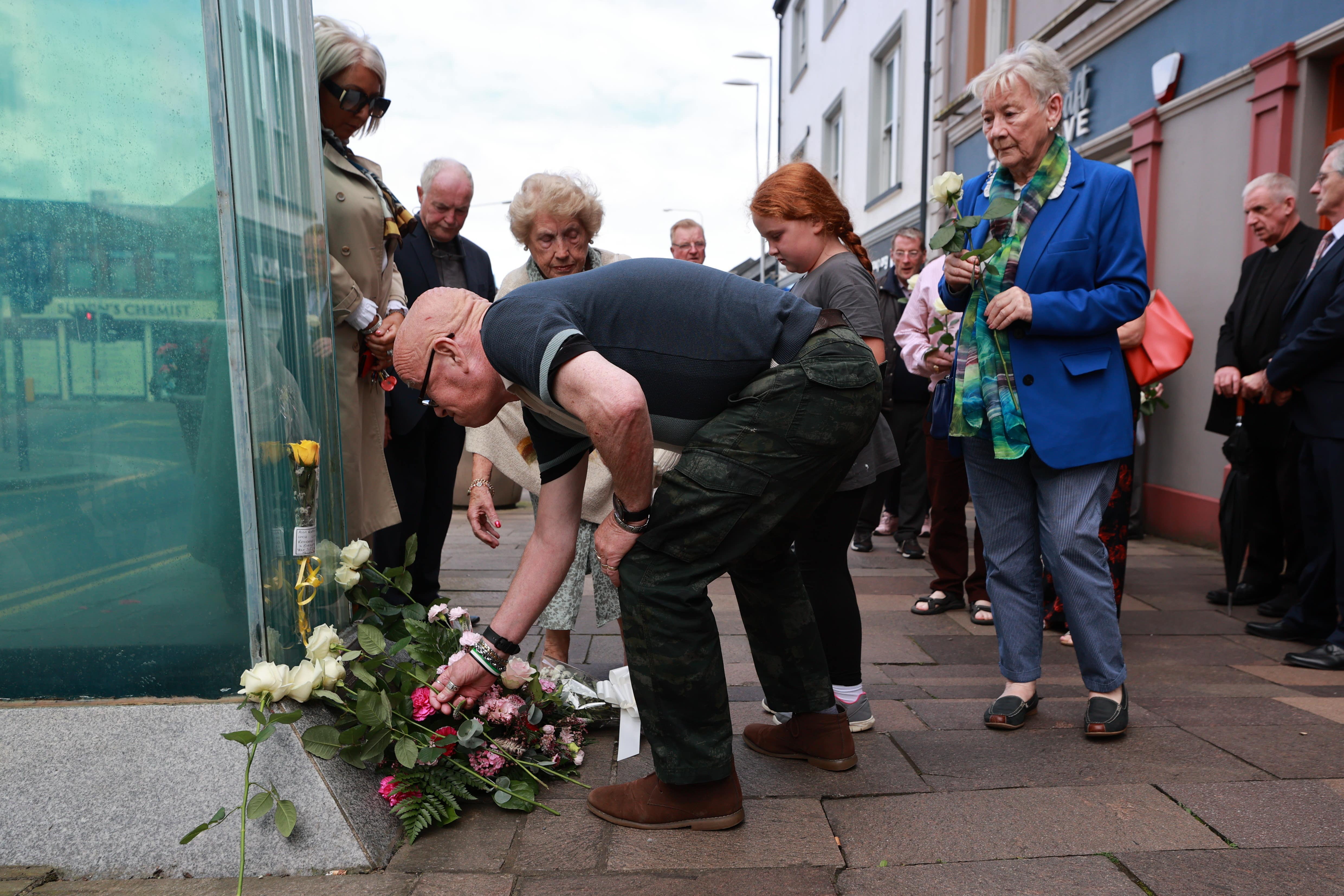 Kevin Skelton lays flowers at the site of the Omagh bombing to remember his wife Philomena (Liam McBurney/PA)