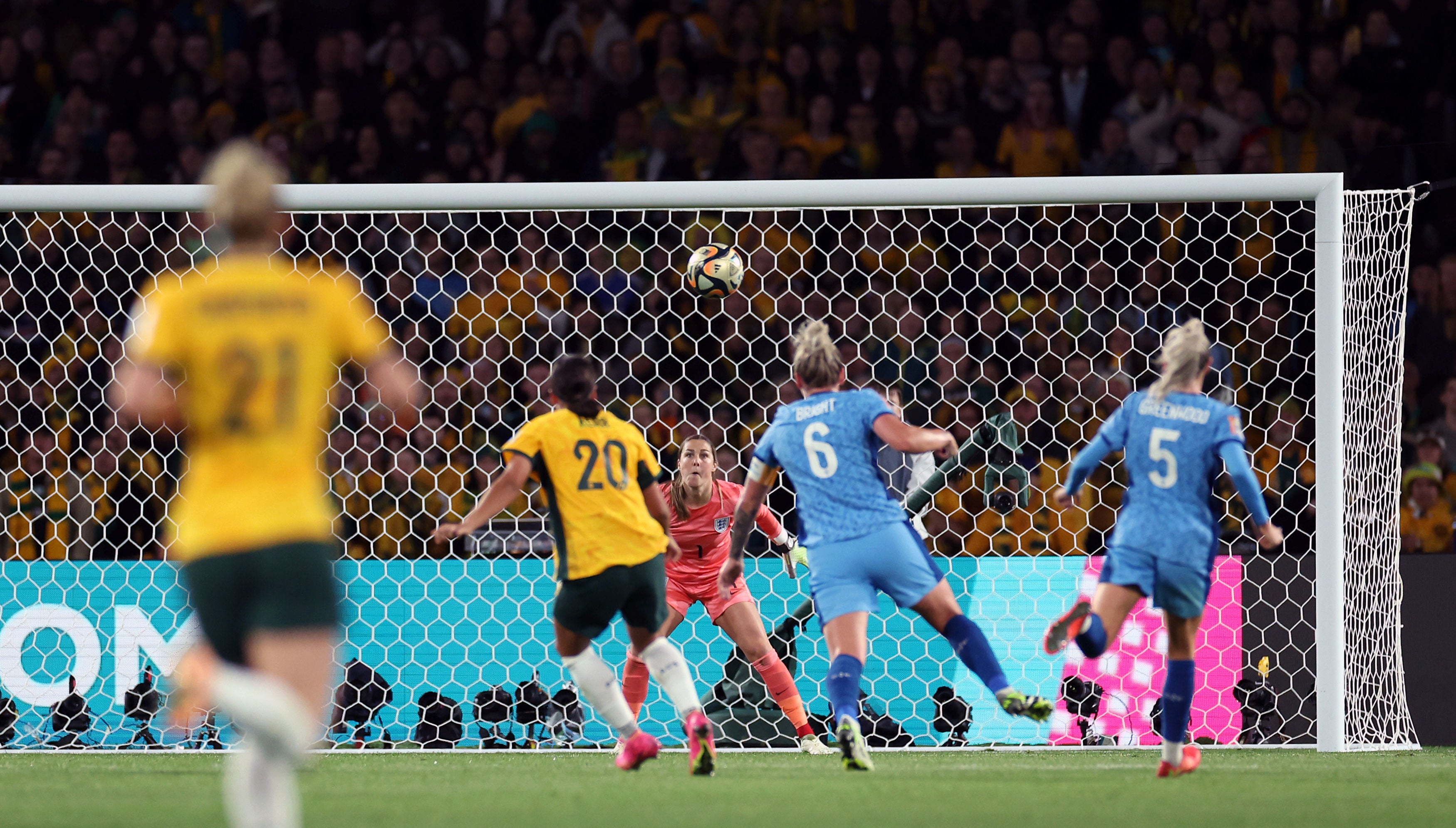 Sam Kerr fires a long-range shot over goalkeeper Mary Earps