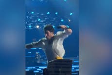 Nick Jonas falls through hole on stage at opening Jonas Brothers concert in Boston