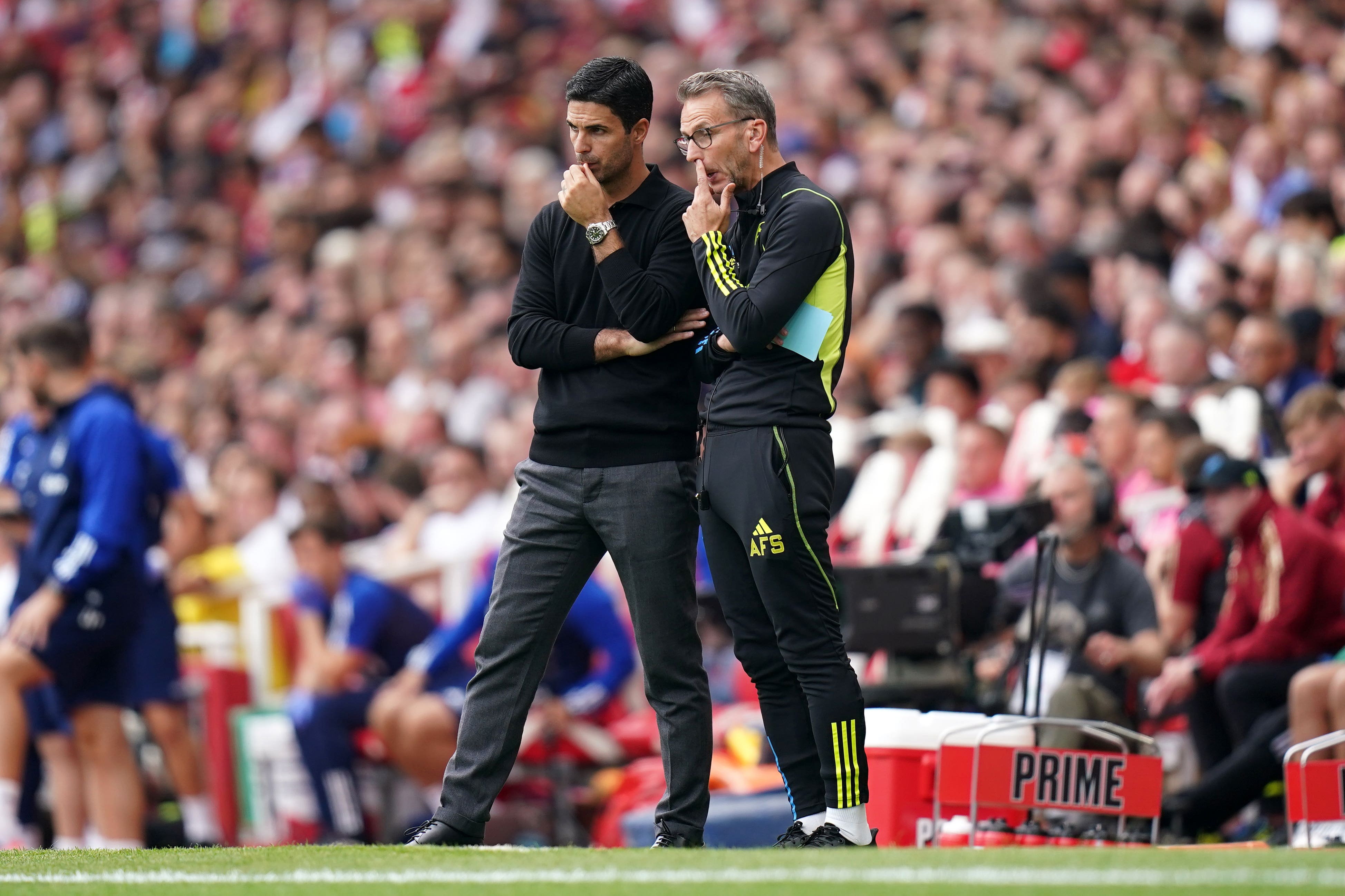 Mikel Arteta, left, has admitted that Arsenal could go back into the transfer market (Adam Davy/PA)