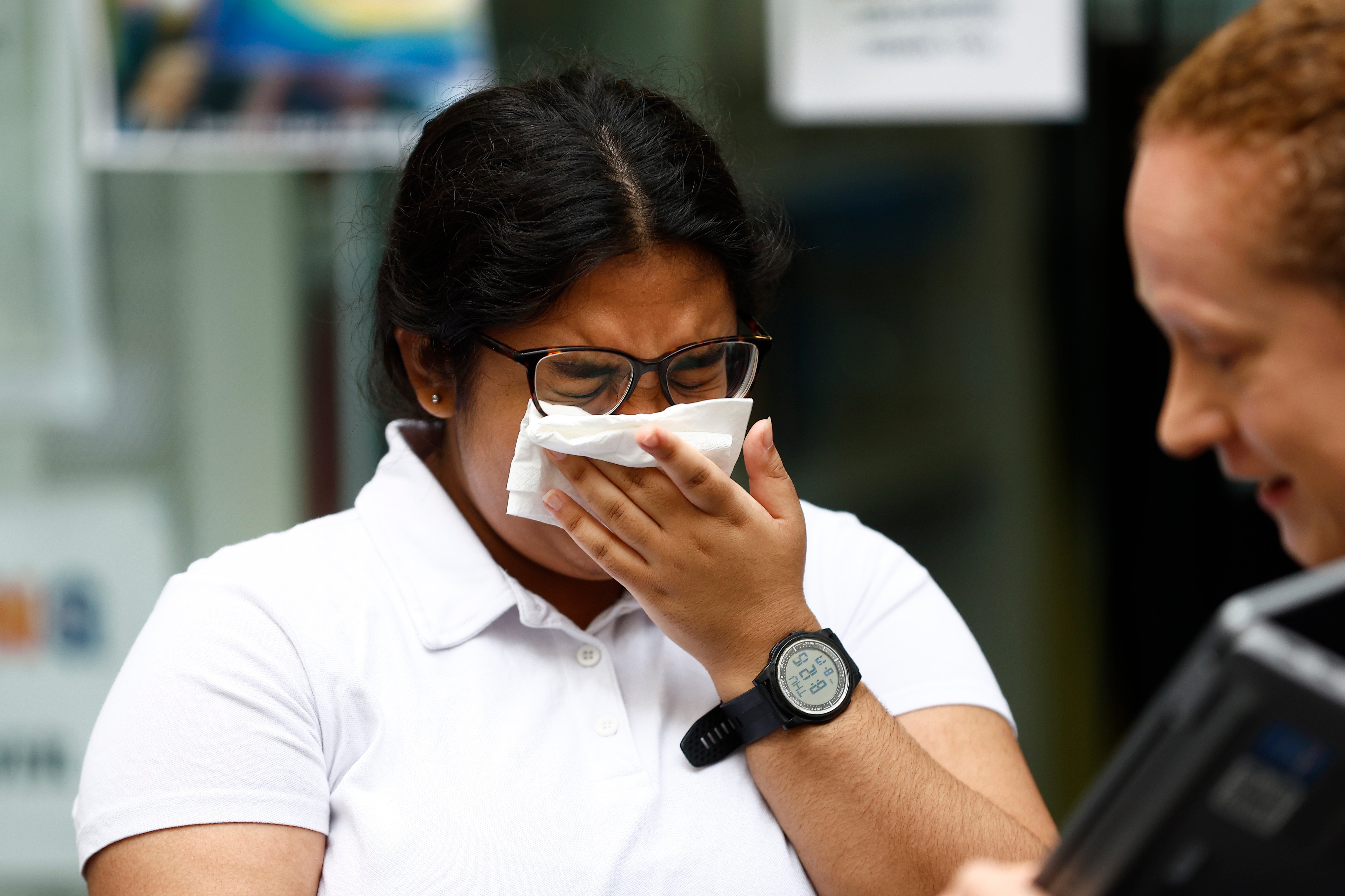 Student Hasena Mahmood reacts after receiving her A-Level results at City of London College