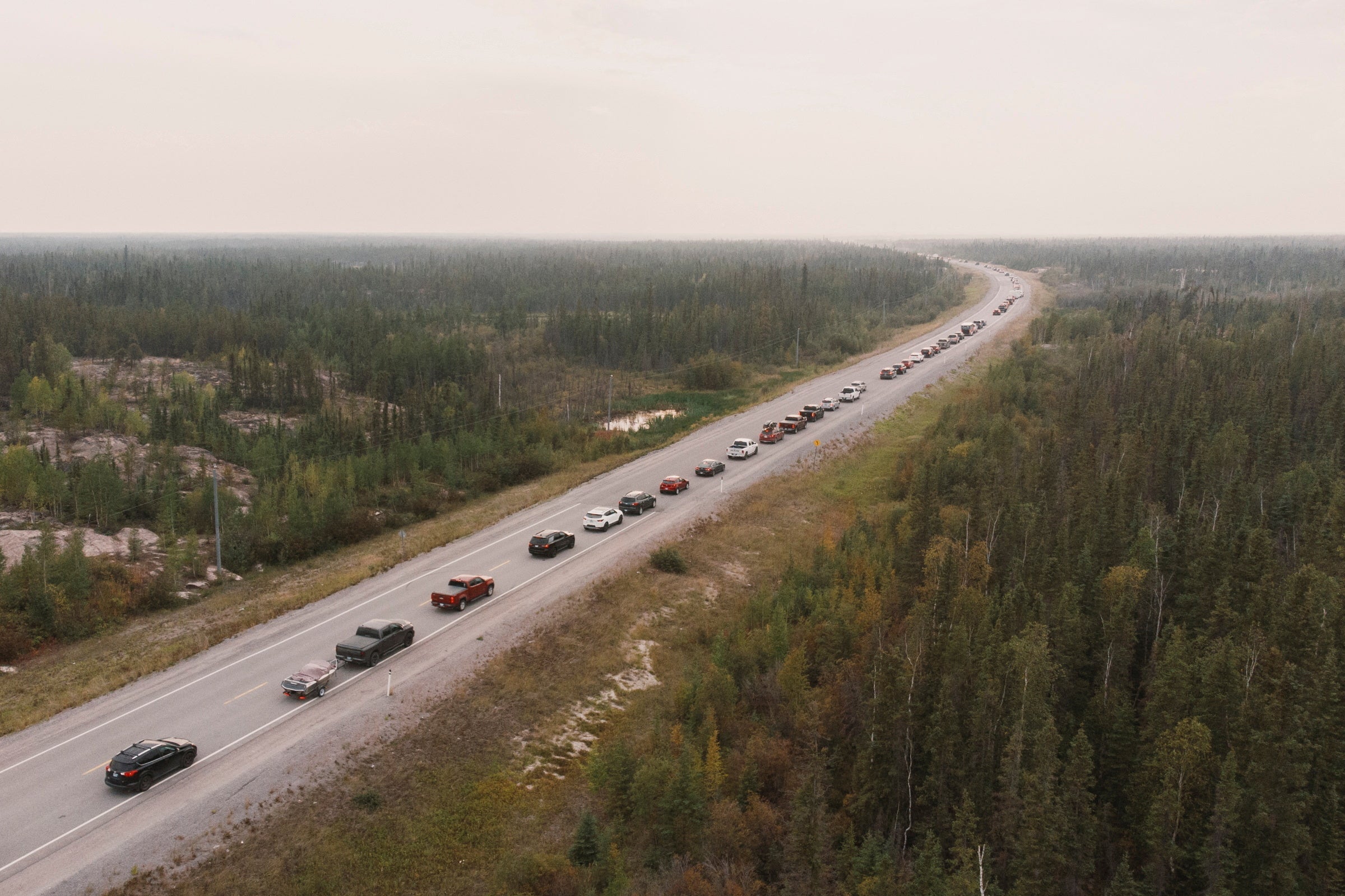 Yellowknife residents leave the city on Highway 3, the only highway in or out of the community, after an evacuation order was given due to the proximity of a wildfire in Yellowknife, Northwest Territories