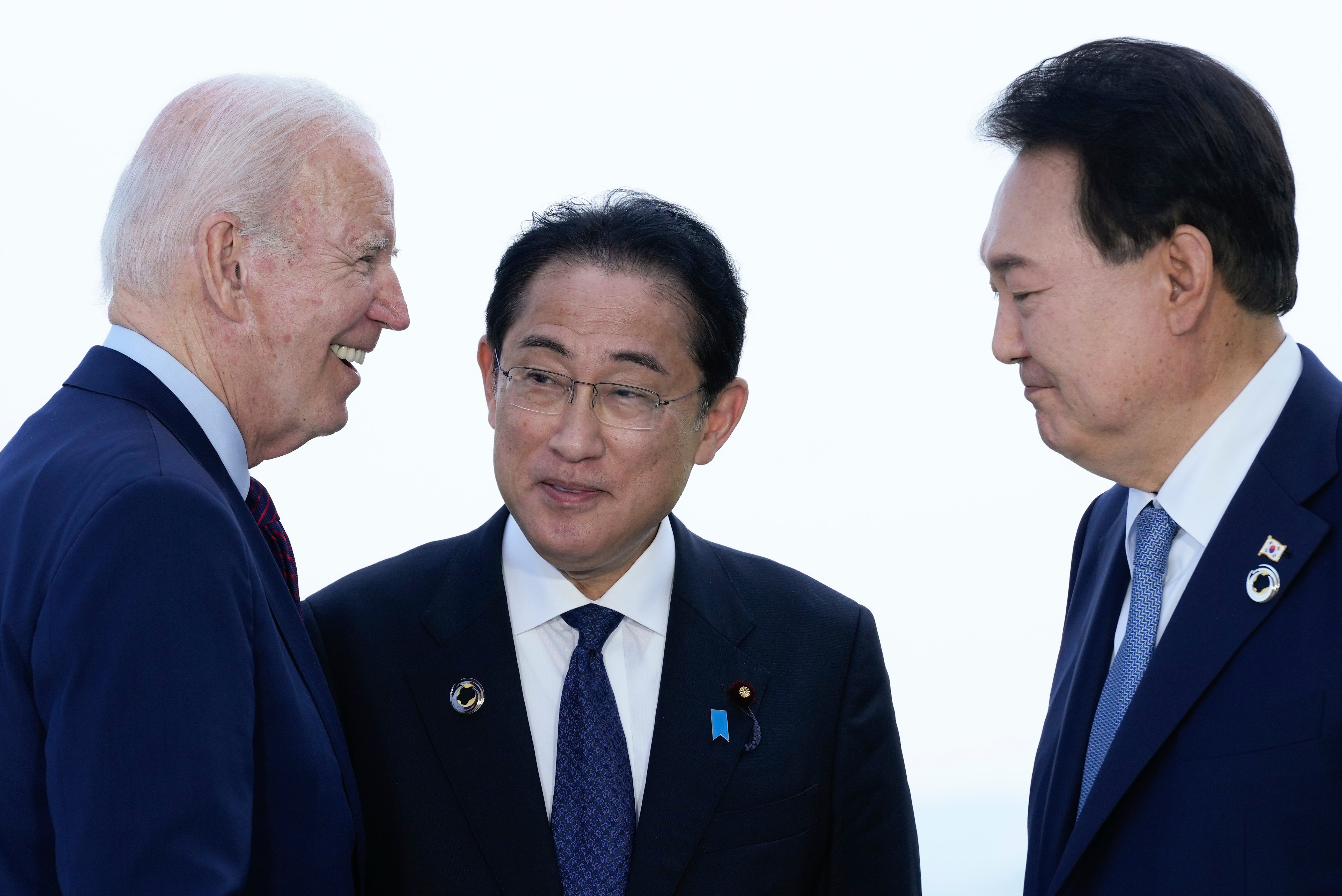 File: Joe Biden (left) is due to host Japan’s Fumio Kishida (centre) and South Korea’s Yoon Suk-yeol (right) for an historic trilateral summit