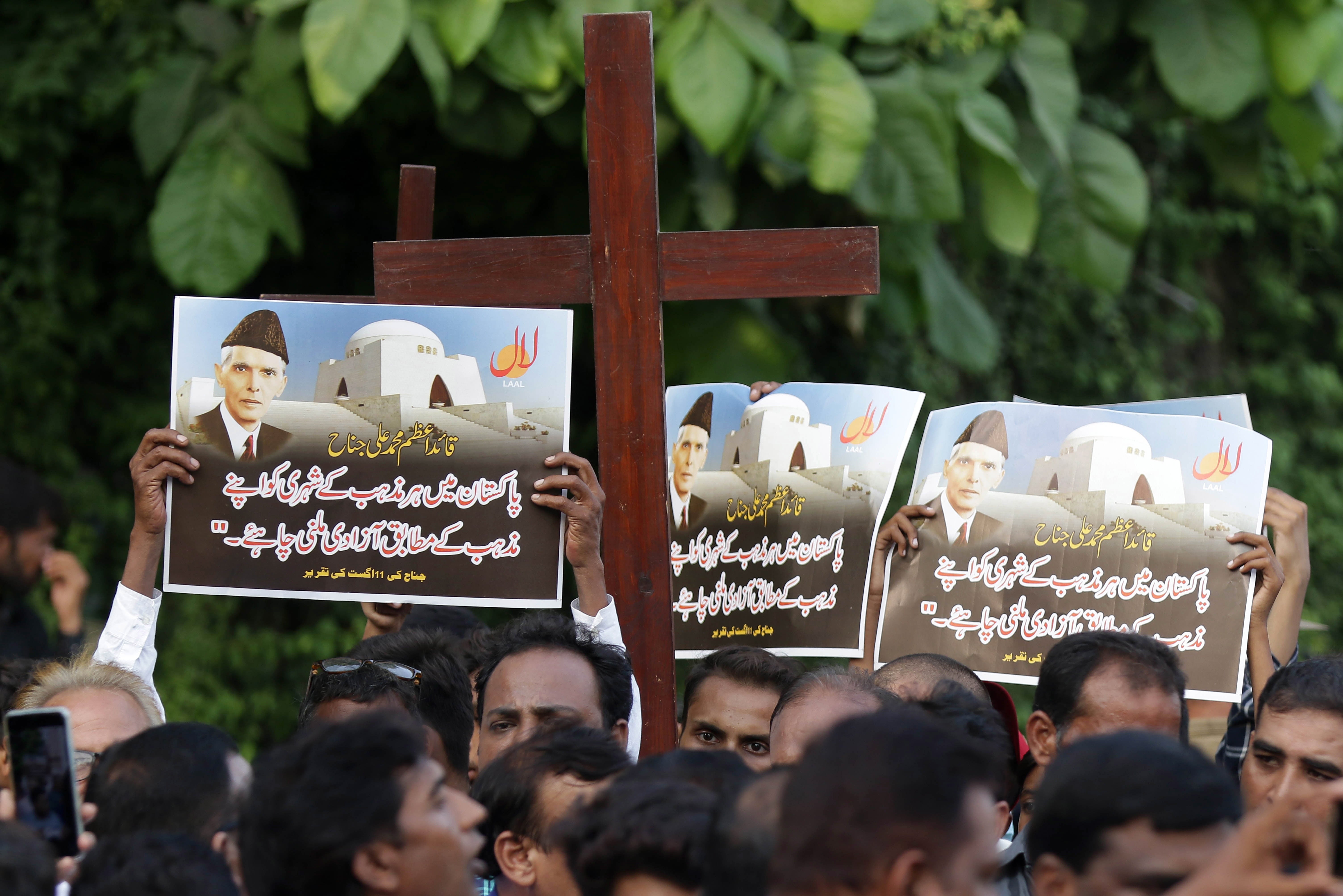 Members of the Christian minority protest against sectarian violence