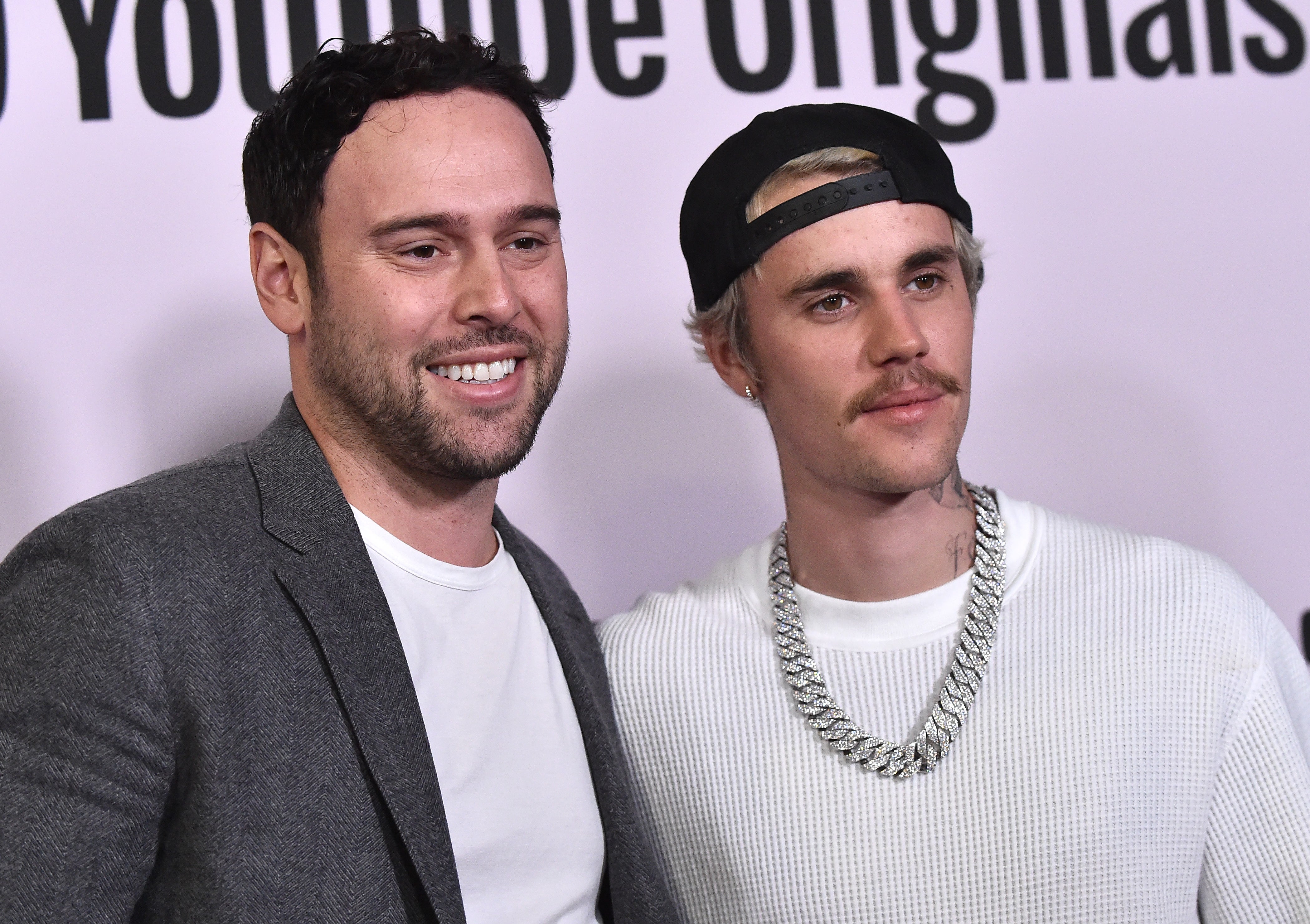 Scott “Scooter” Braun poses with Justin Bieber, whose career he helped launch after spotting one of the young Canadian’s 2007 YouTube videos