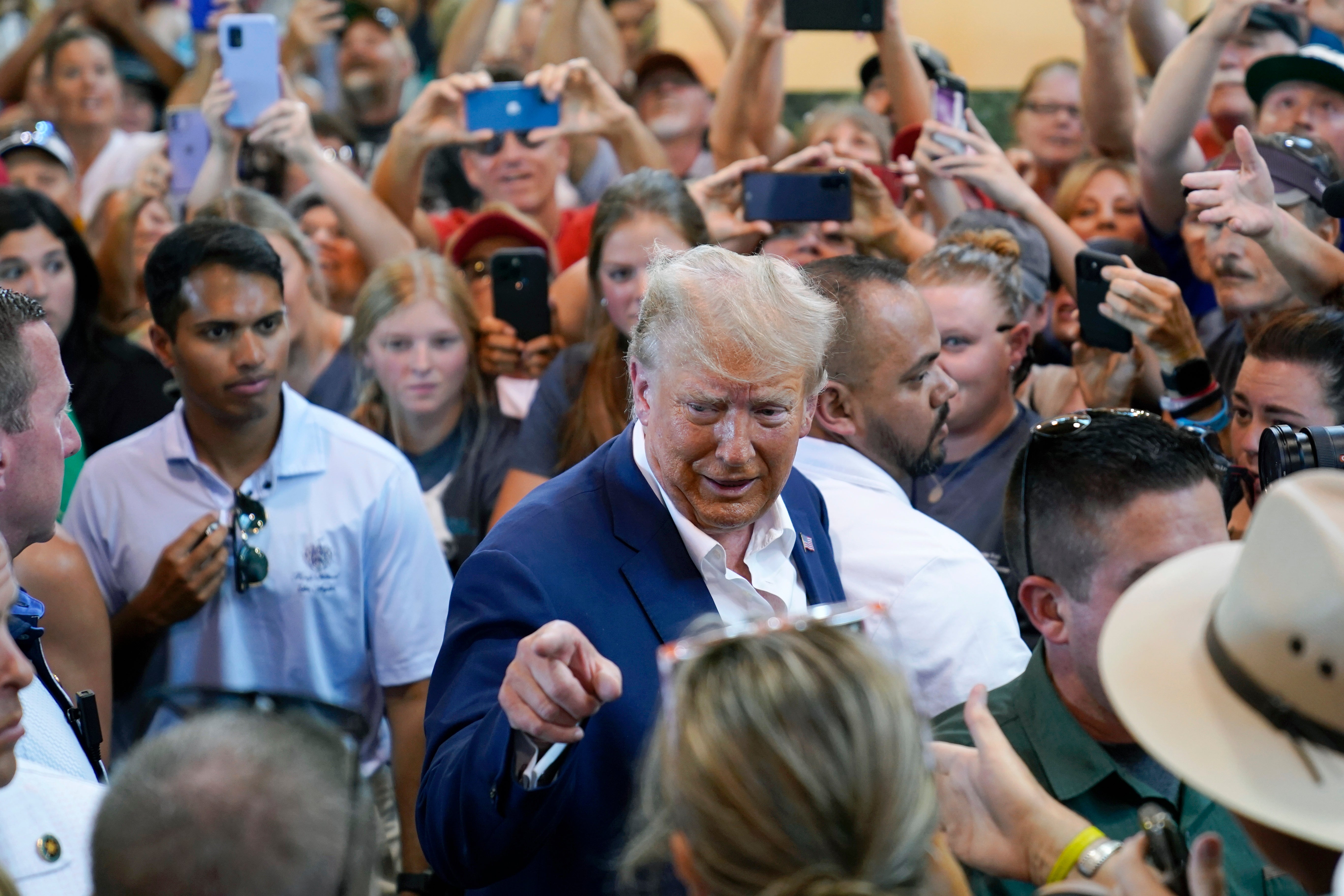 Republican presidential candidate Donald Trump greets supporters during a visit to the Iowa State Fair on 12 August