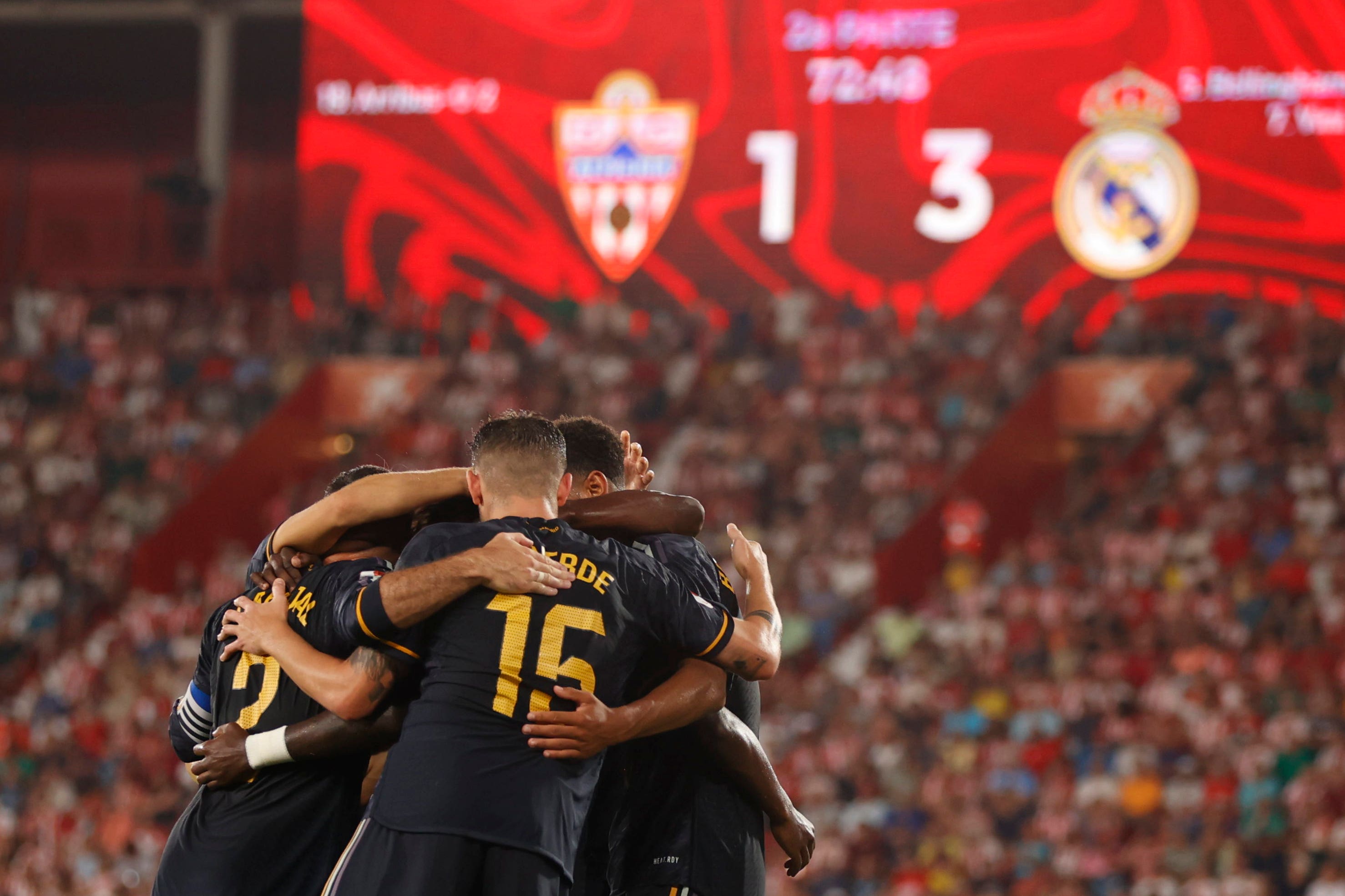 Real Madrid players celebrate after Vinicius Junior scored his side’s third goal in the win at Almeria (Fermin Rodriguez/AP)