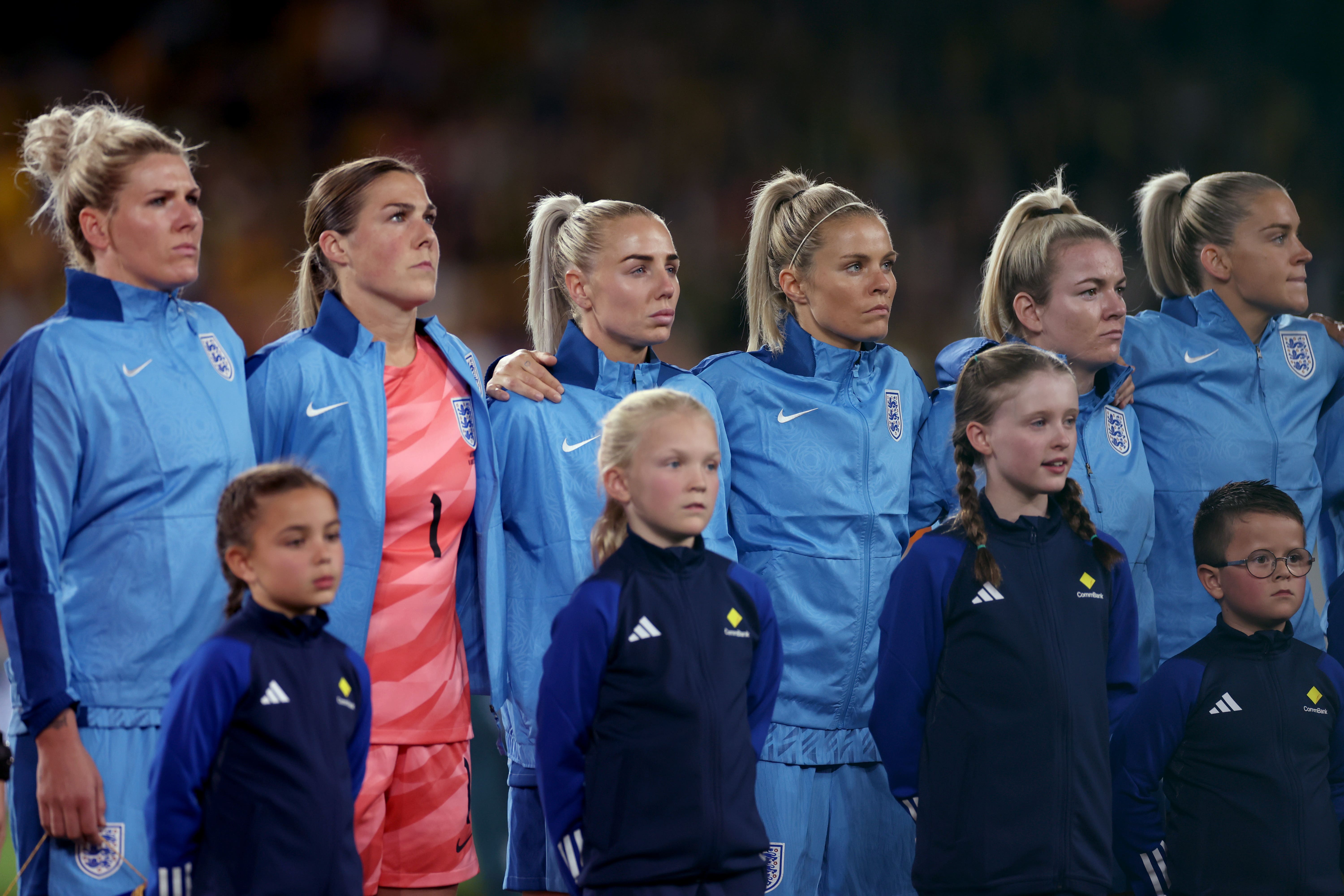 The England team sing the national anthem (PA)