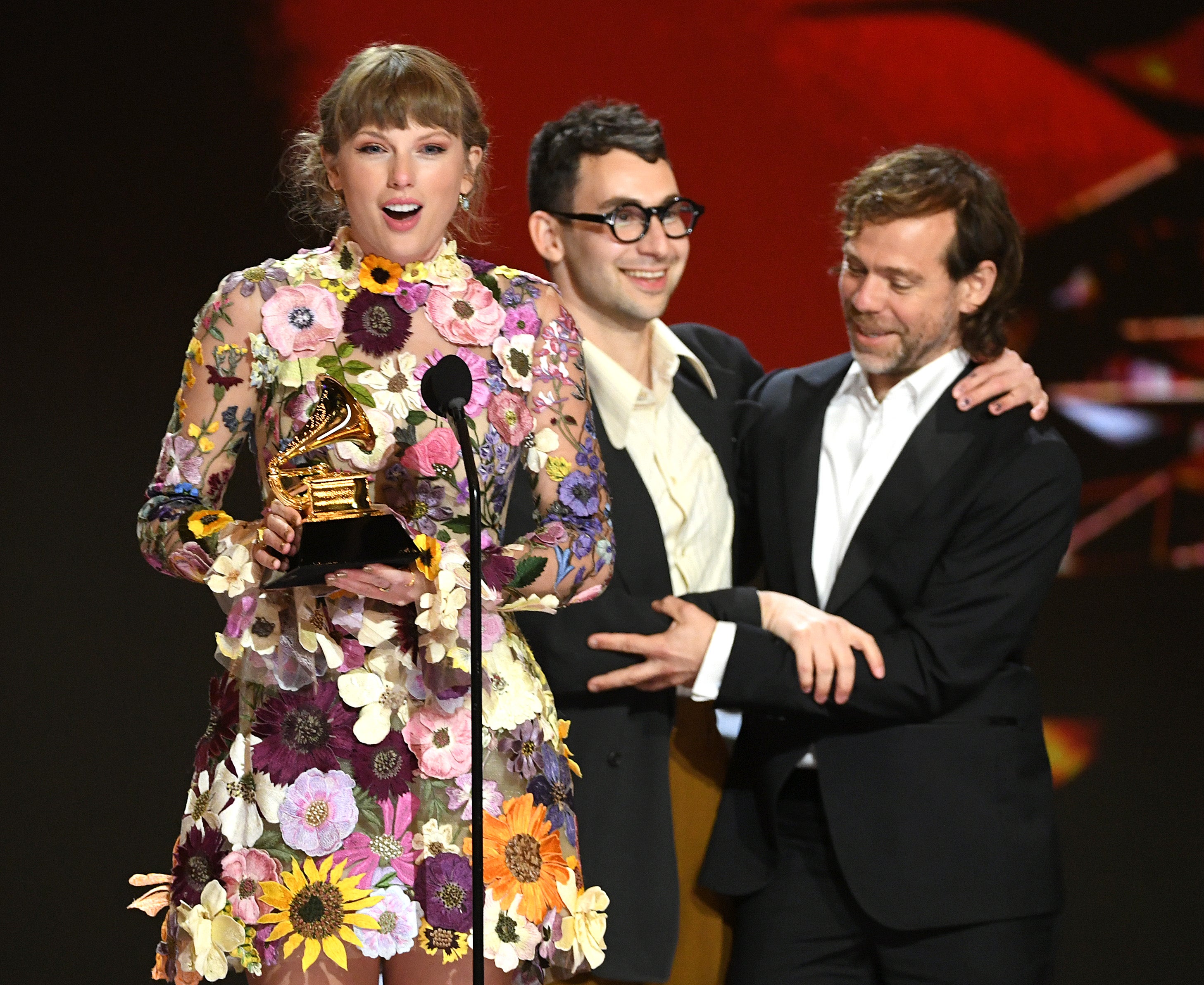 Taylor Swift, Jack Antonoff, and Aaron Dessner accept the Album of the Year award for Folklore onstage during the 63rd Annual GRAMMY Awards at Los Angeles Convention Center on March 14, 2021