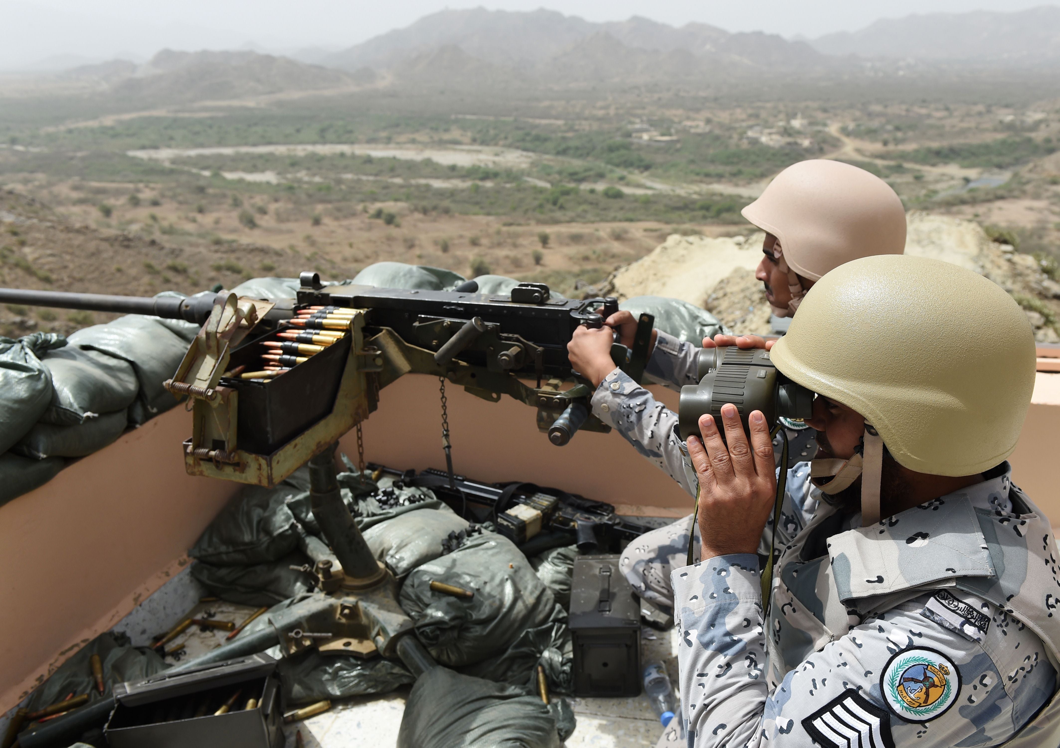 File: Members of the Saudi border guard are stationed at a look-out point on the Saudi-Yemeni border