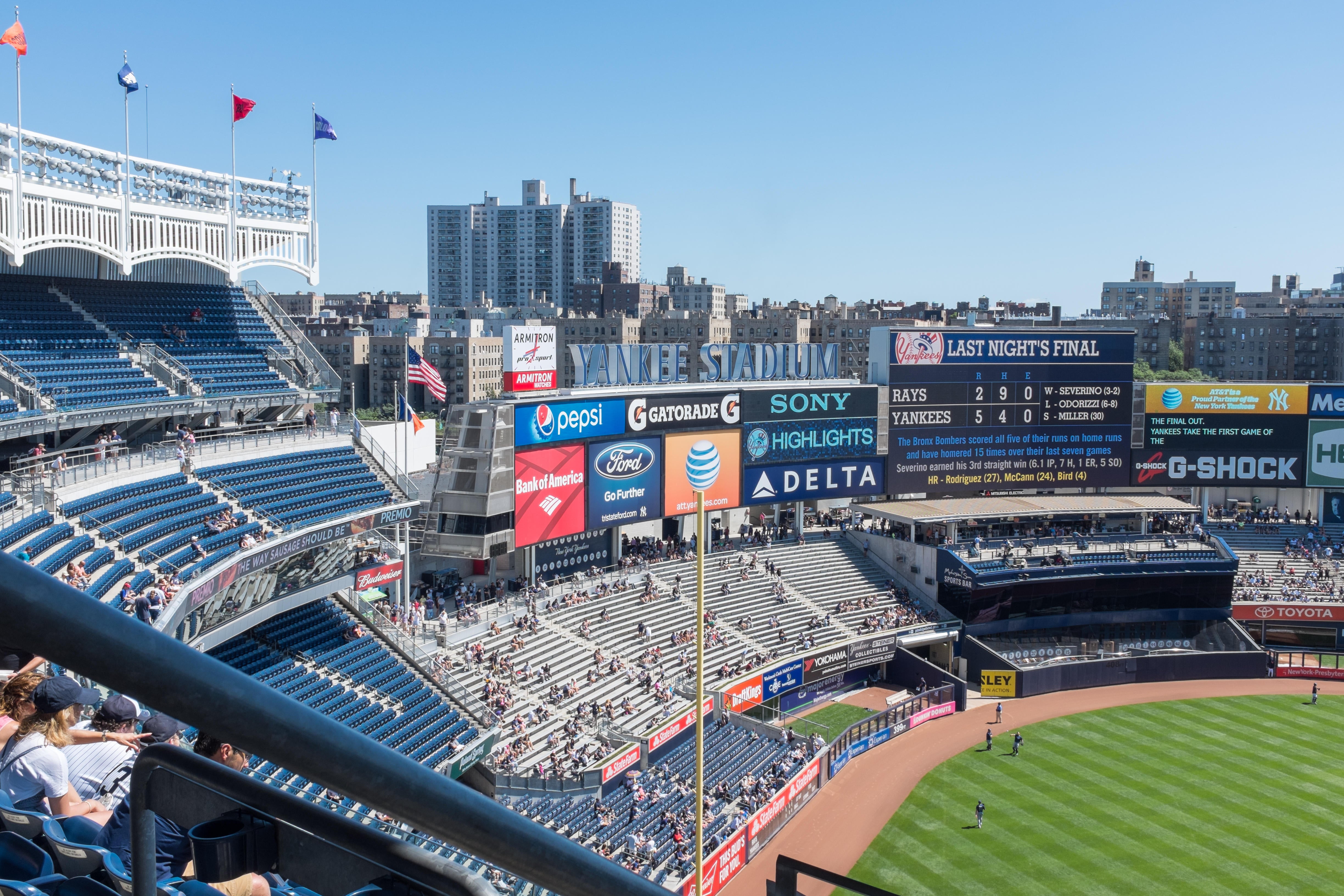 Fans watching a baseball game inside the Yankee Stadium