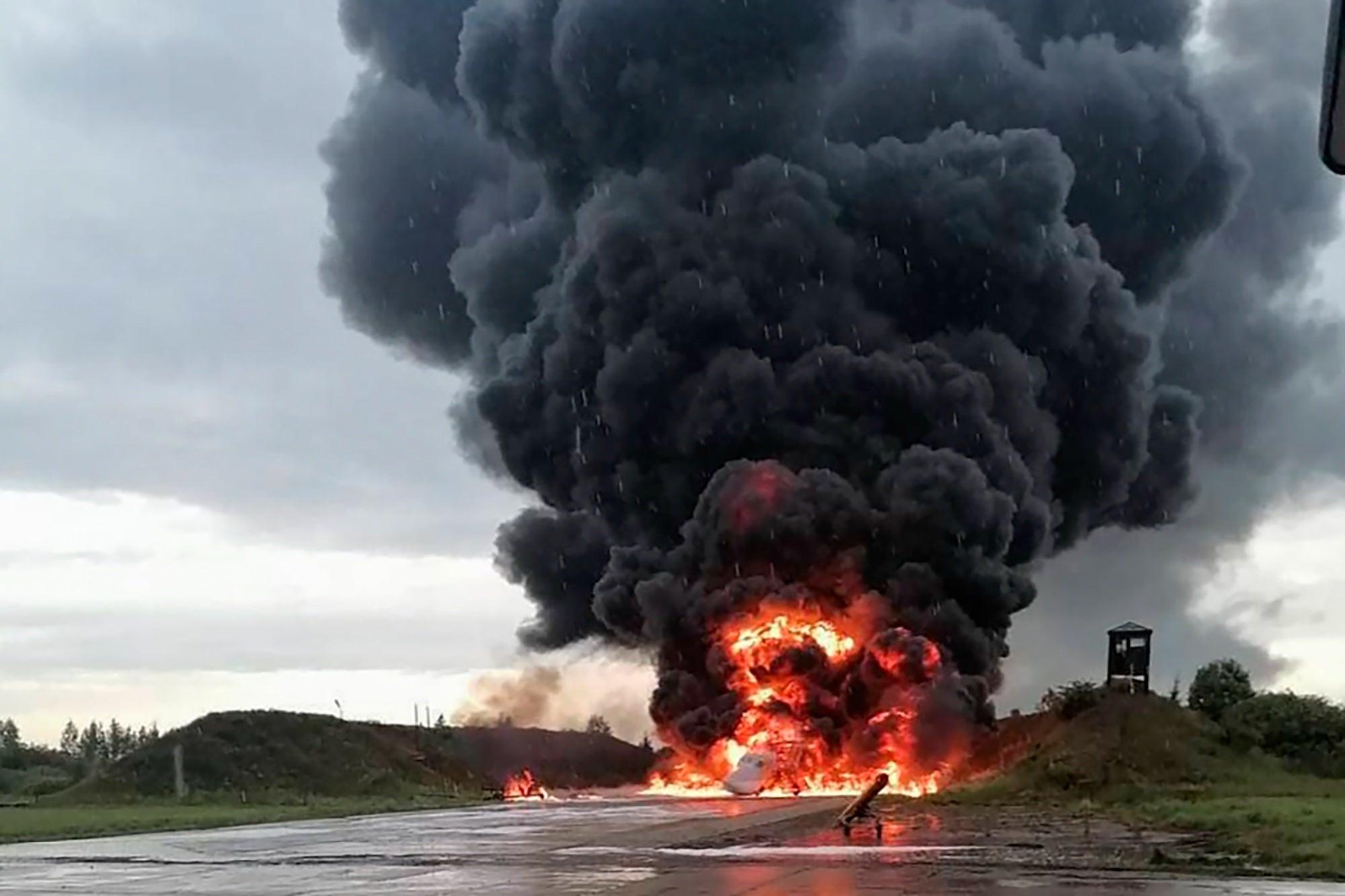 A Russian warplane burning on the Soltsy air base in the Novgorod region in northwestern Russia in images from social media