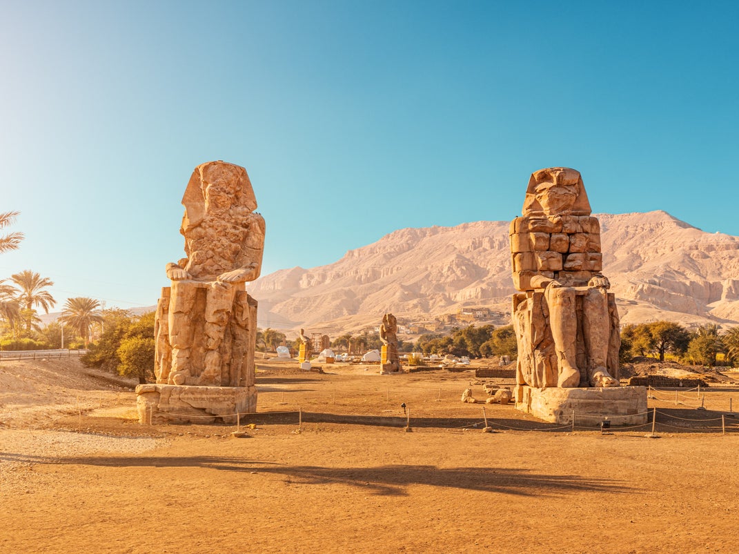 Two towering statues are attributed to 18th-dynasty Pharaoh Amenhotep III